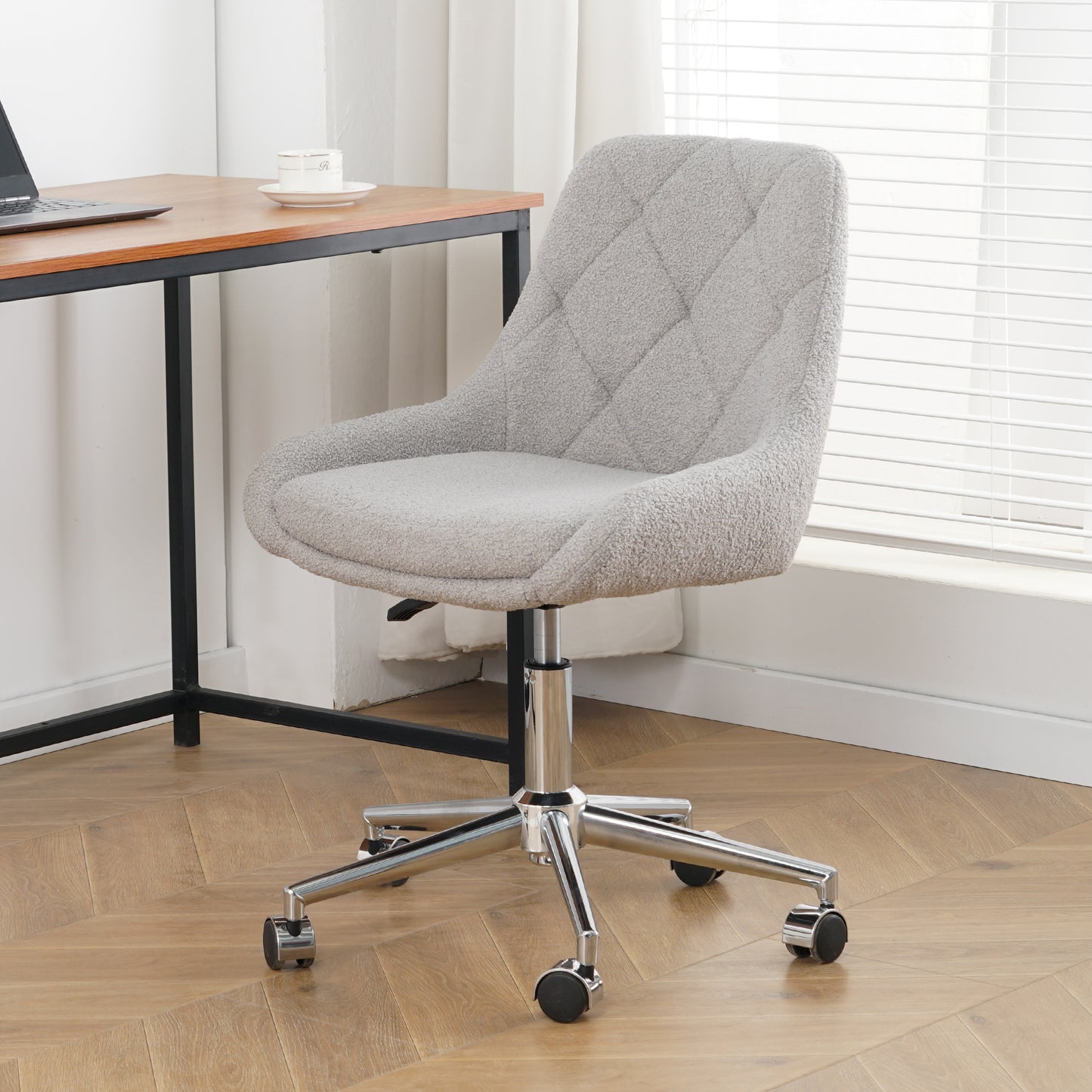 Gray boucl office chair with diamond tufting and chrome base