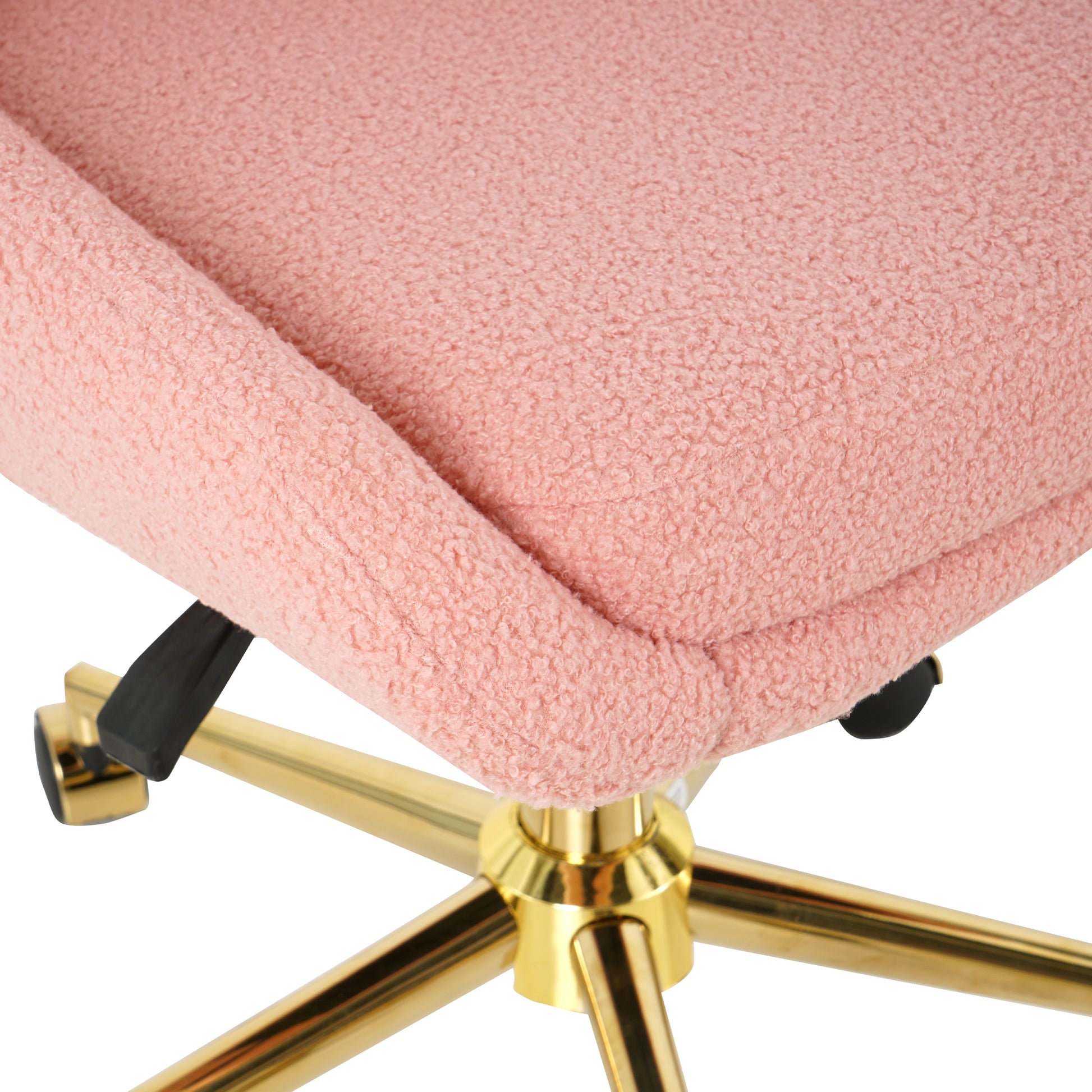 Closeup of plush pink teddy fabric seat cushion on a gold rolling office chair base