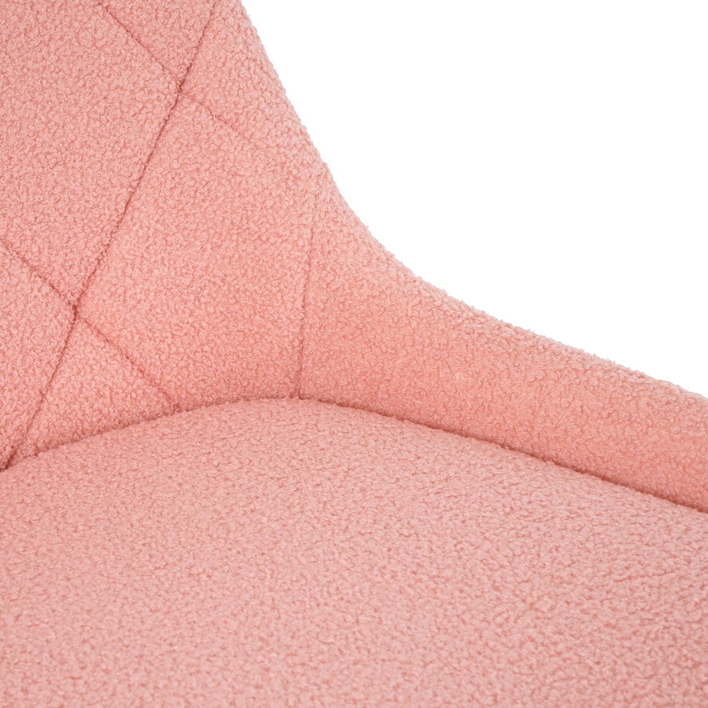 Closeup of plush pink boucle fabric on a chair seat with diamond quilting