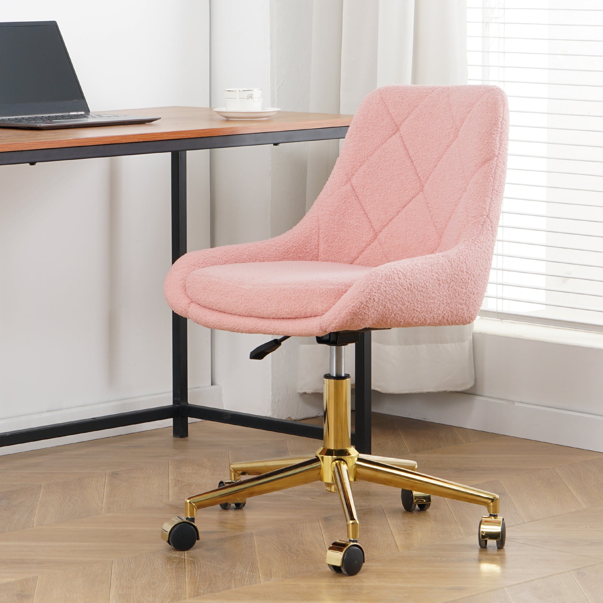 Pink sherpa desk chair with quilted diamond pattern and gold base