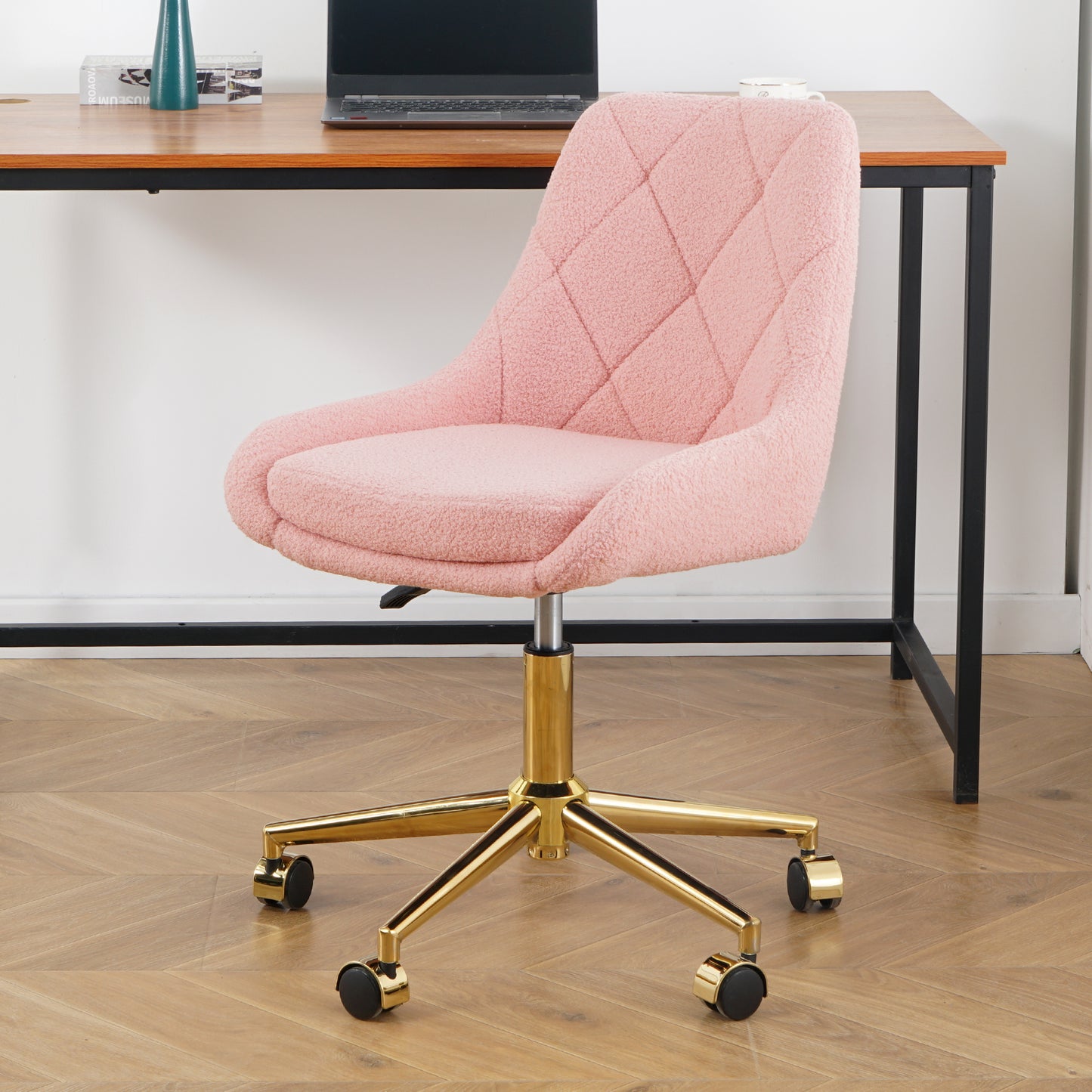 Pink boucle desk chair with diamond quilting and gold base
