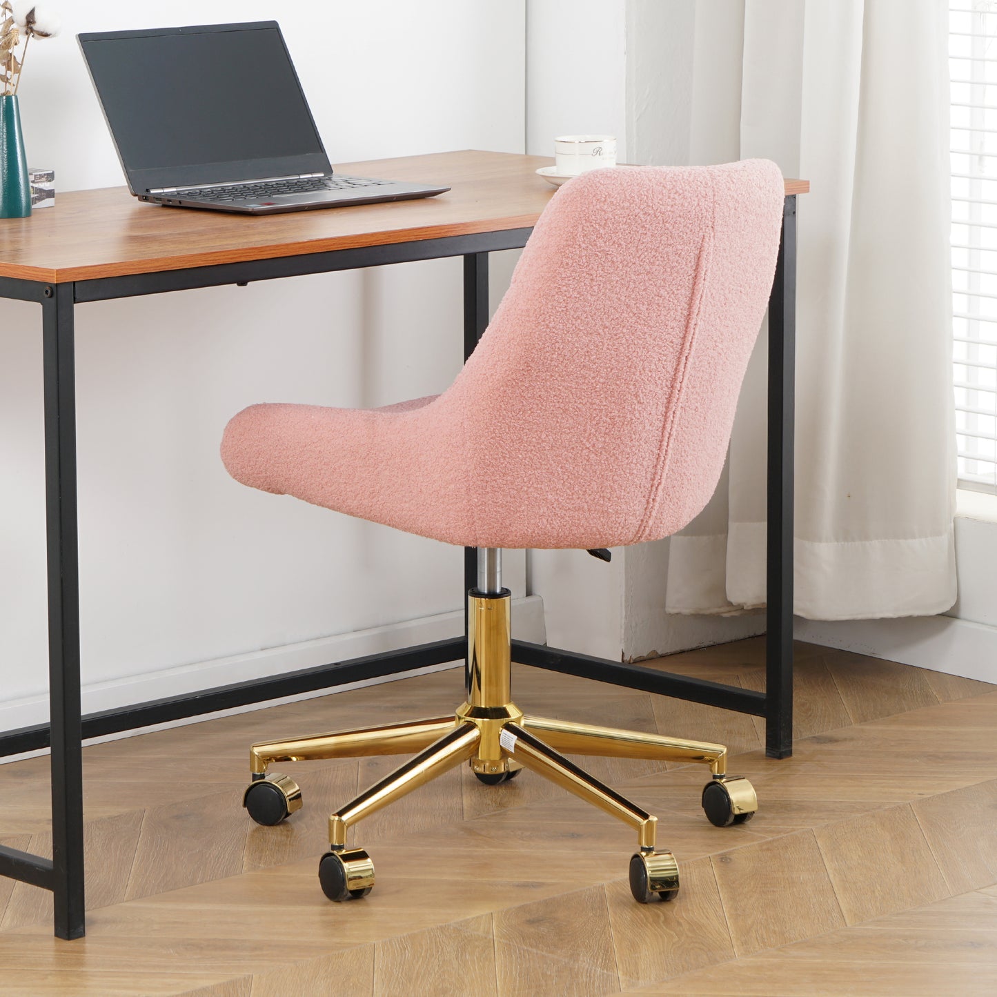 Pink boucl office chair with gold base and wheels