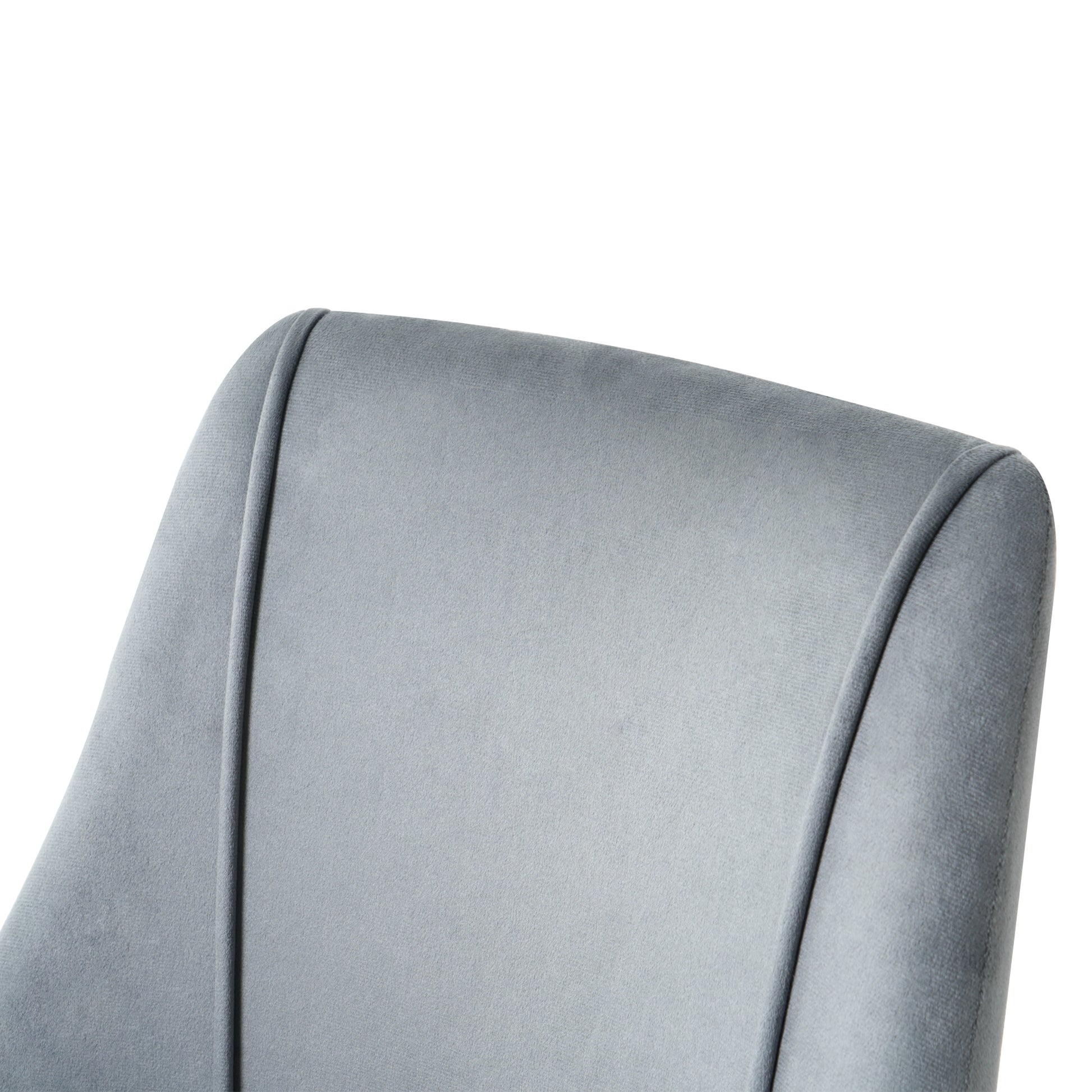 Closeup of a plush grey velvet chair back with subtle stitching