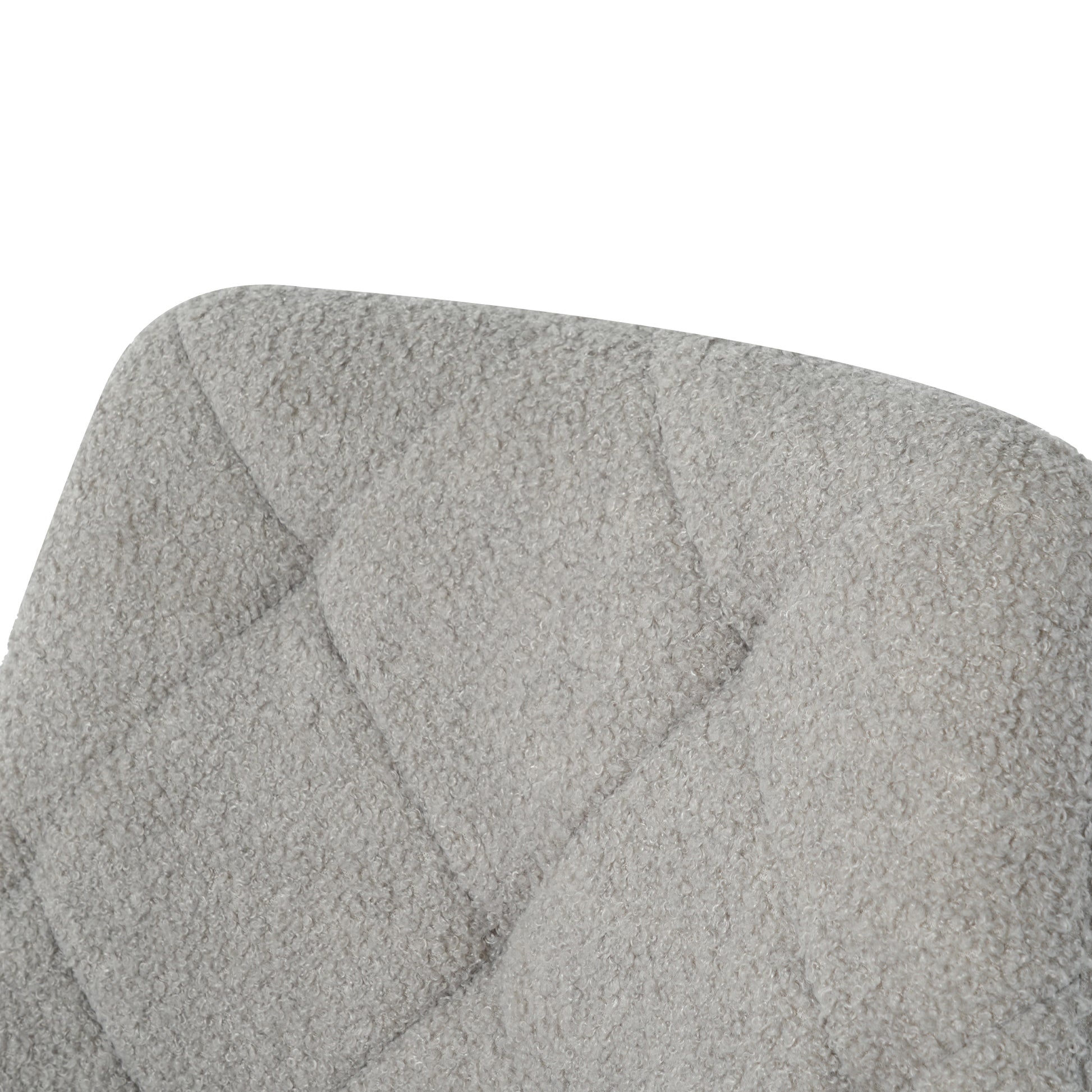 Quilted grey boucle fabric on a chair back