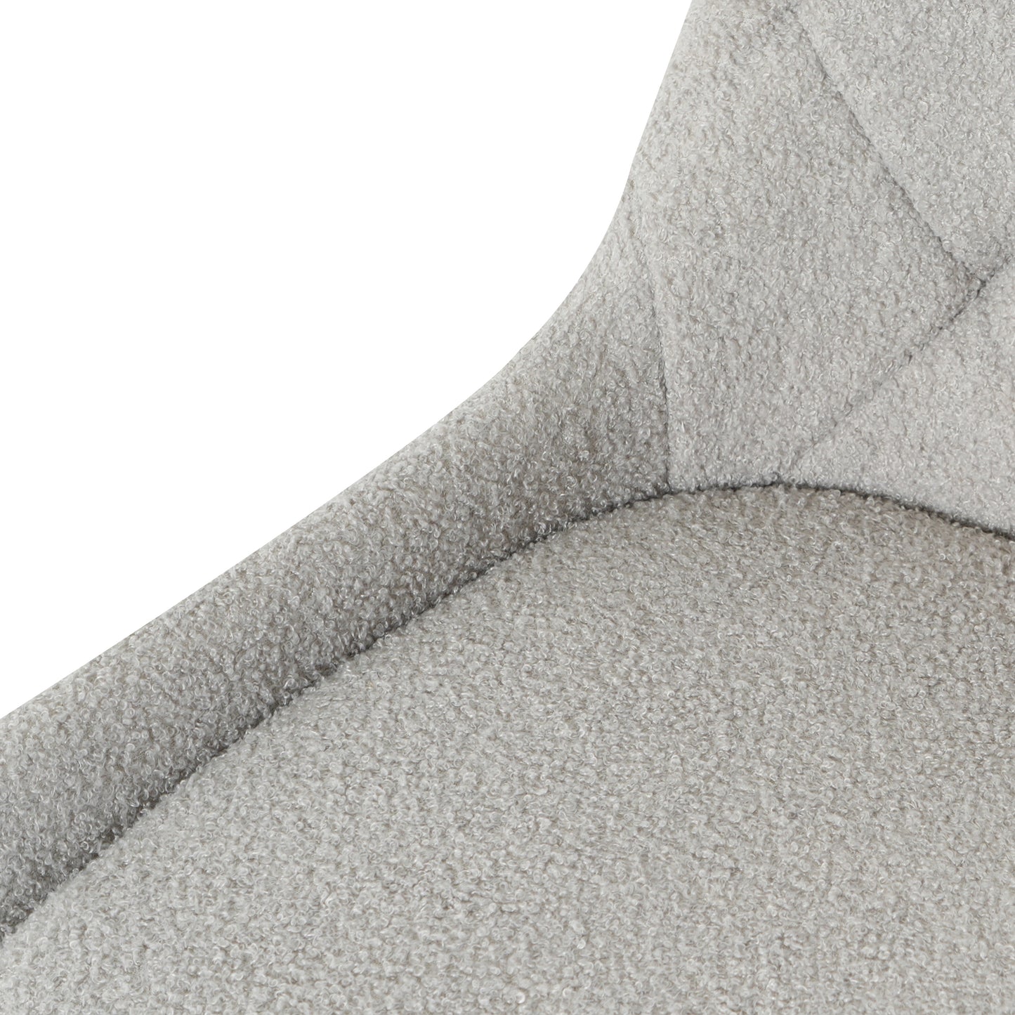 Closeup of light grey boucle fabric on a modern chair