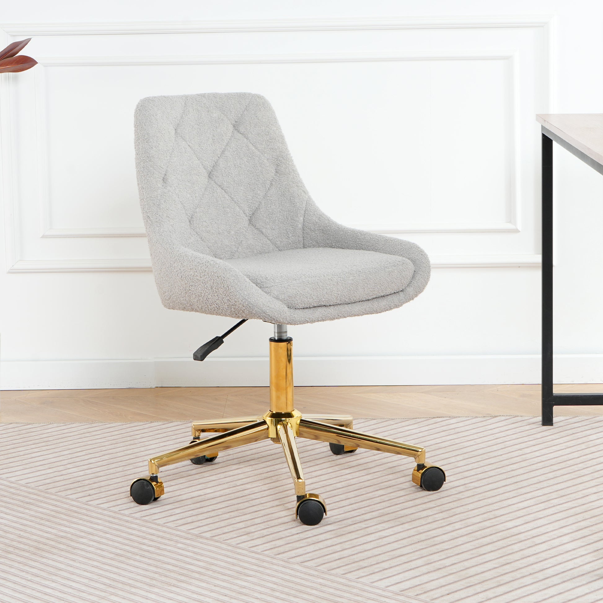 Light grey boucle fabric desk chair with diamond tufting and gold base