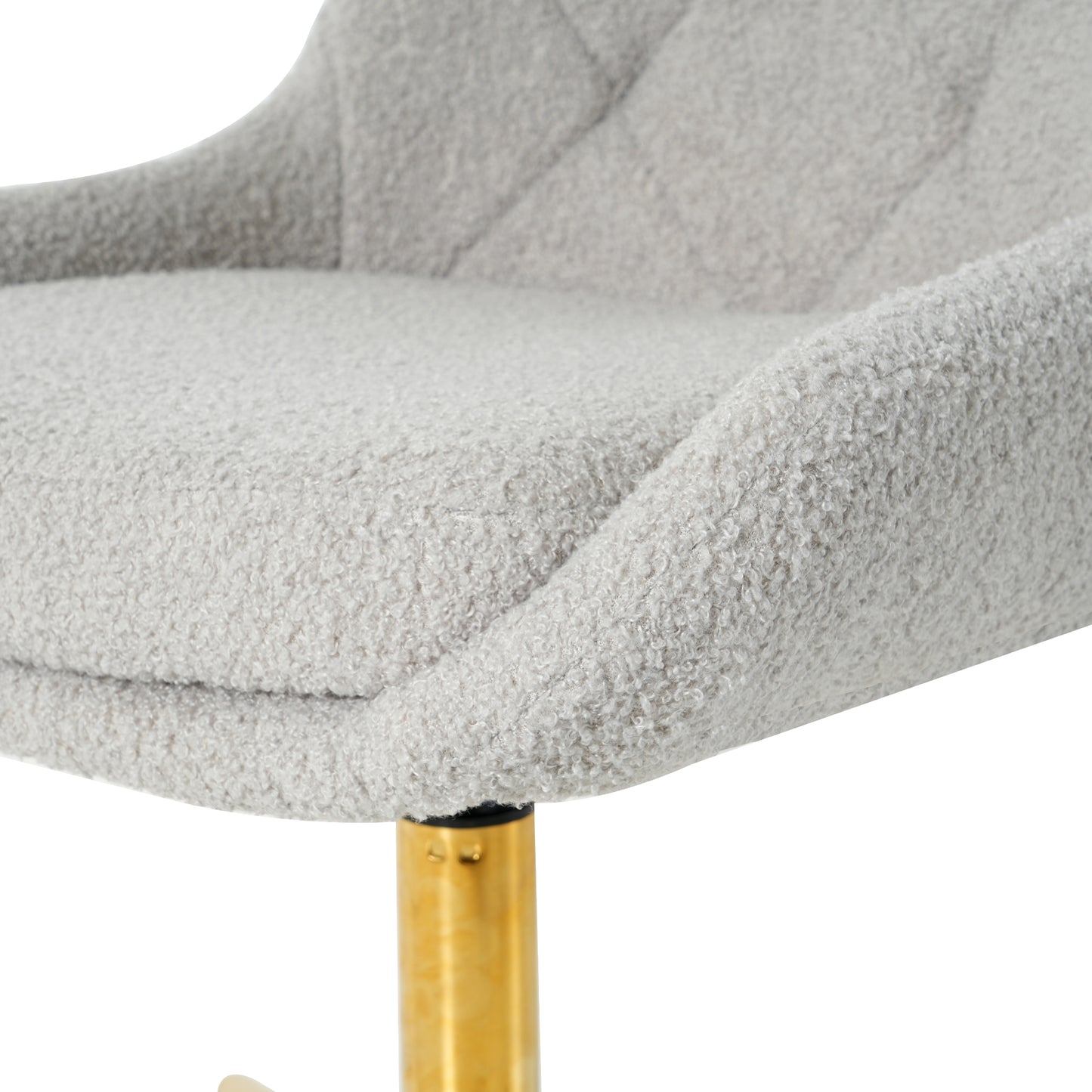 Closeup of a plush grey boucle fabric bar stool seat with a textured finish and diamond tufting