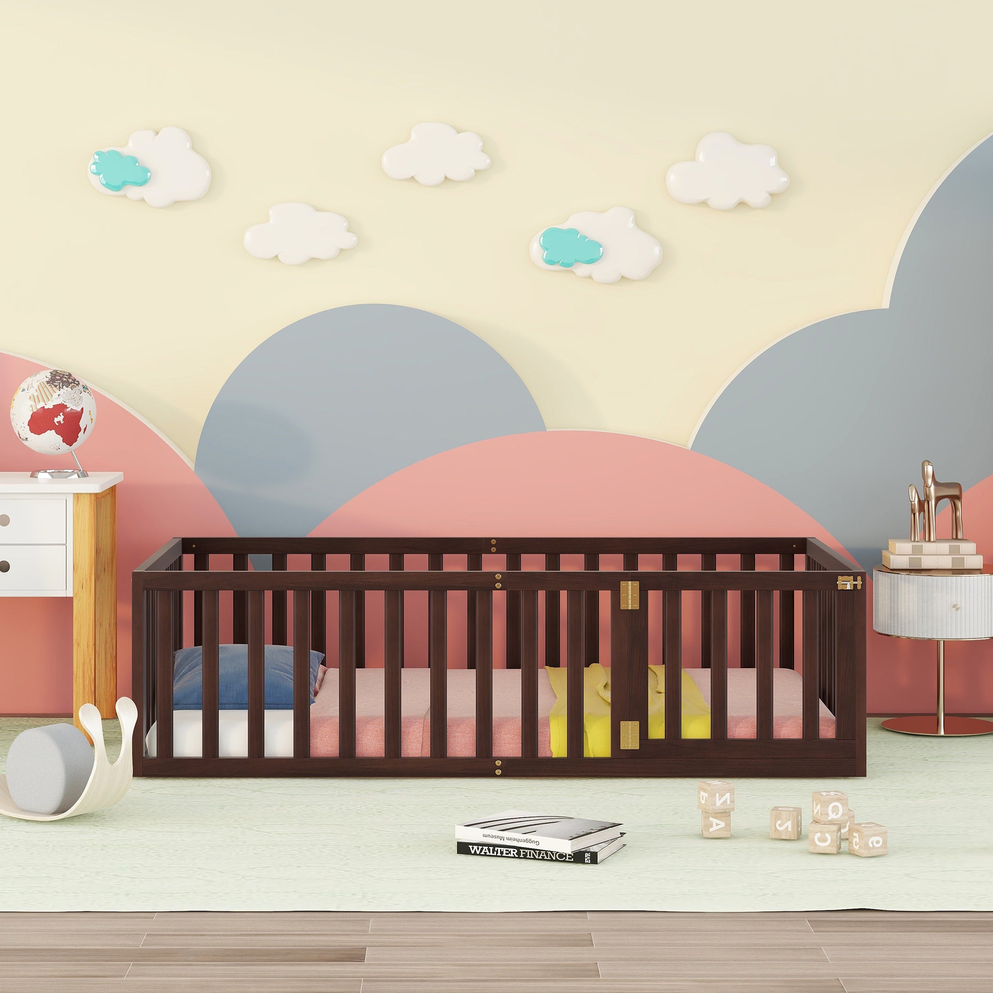 Dark wood baby crib with pastel bedding and cloud wall decor