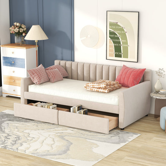 Beige upholstered sofa bed with storage drawers and plaid pillows