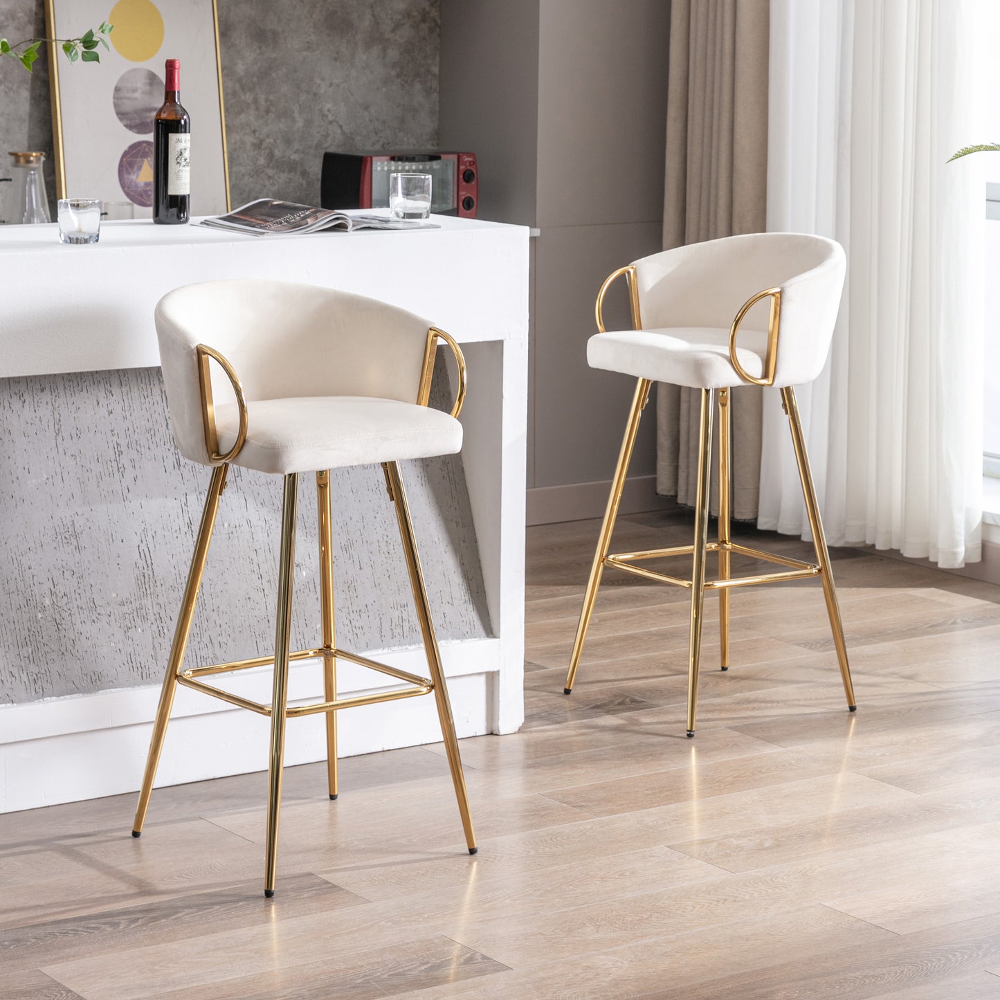 Cream velvet bar stool with gold metal legs and armrests