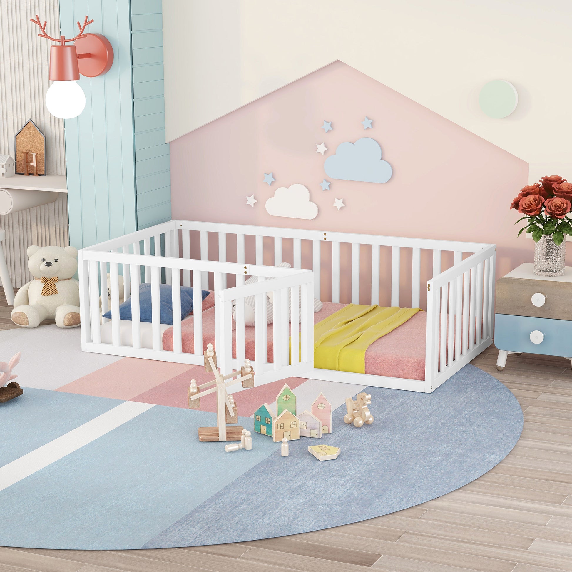 White wooden toddler bed with bedding and safety rails