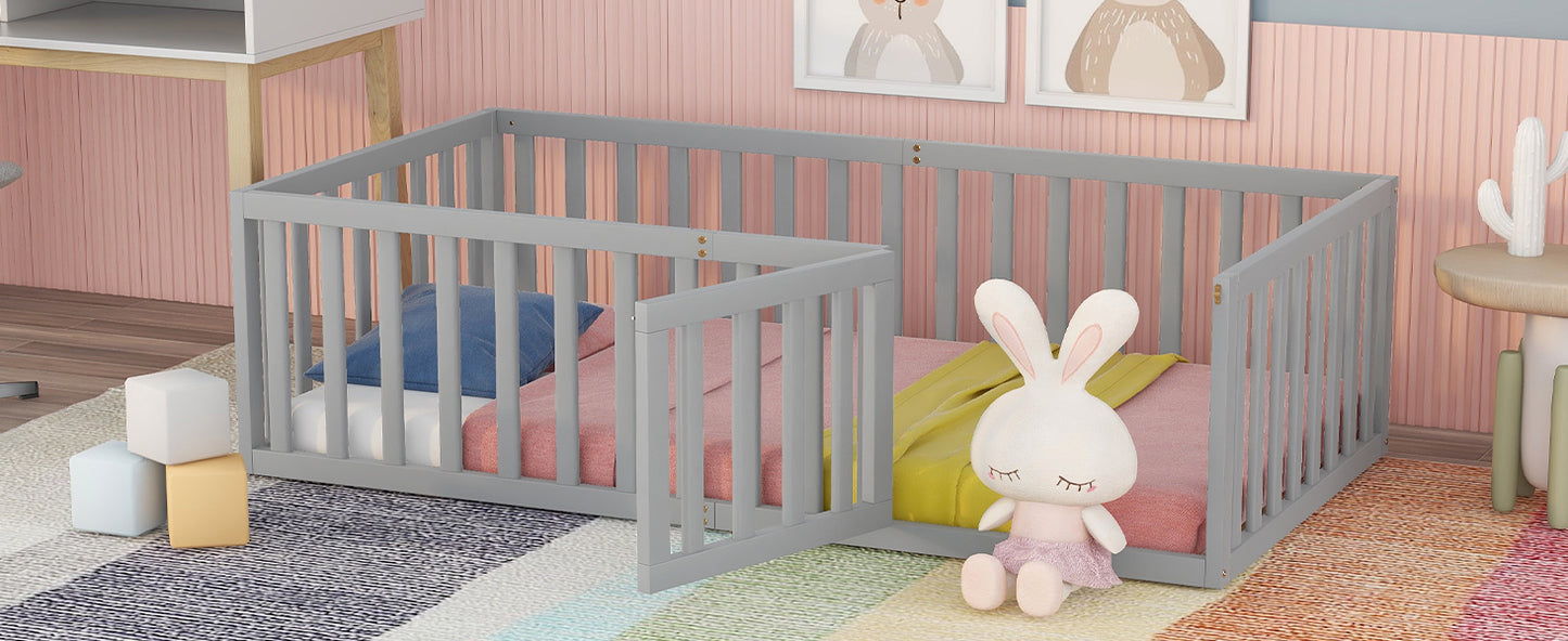 Grey convertible toddler bed with pink mattress and blue pillow