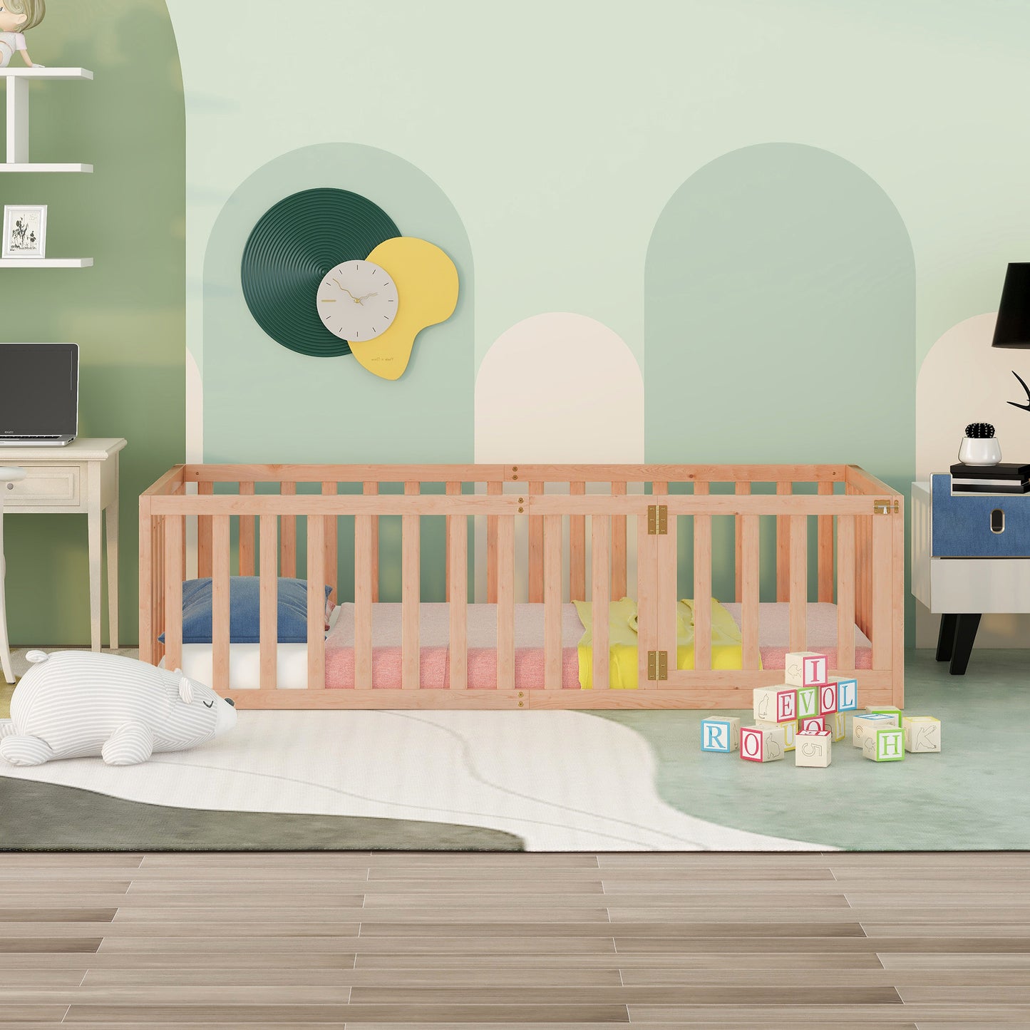 Natural wood baby bed with pastel bedding and stuffed animal