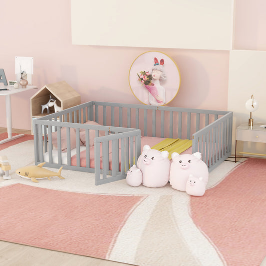 Gray wooden toddler bed with pink bedding and shark toy