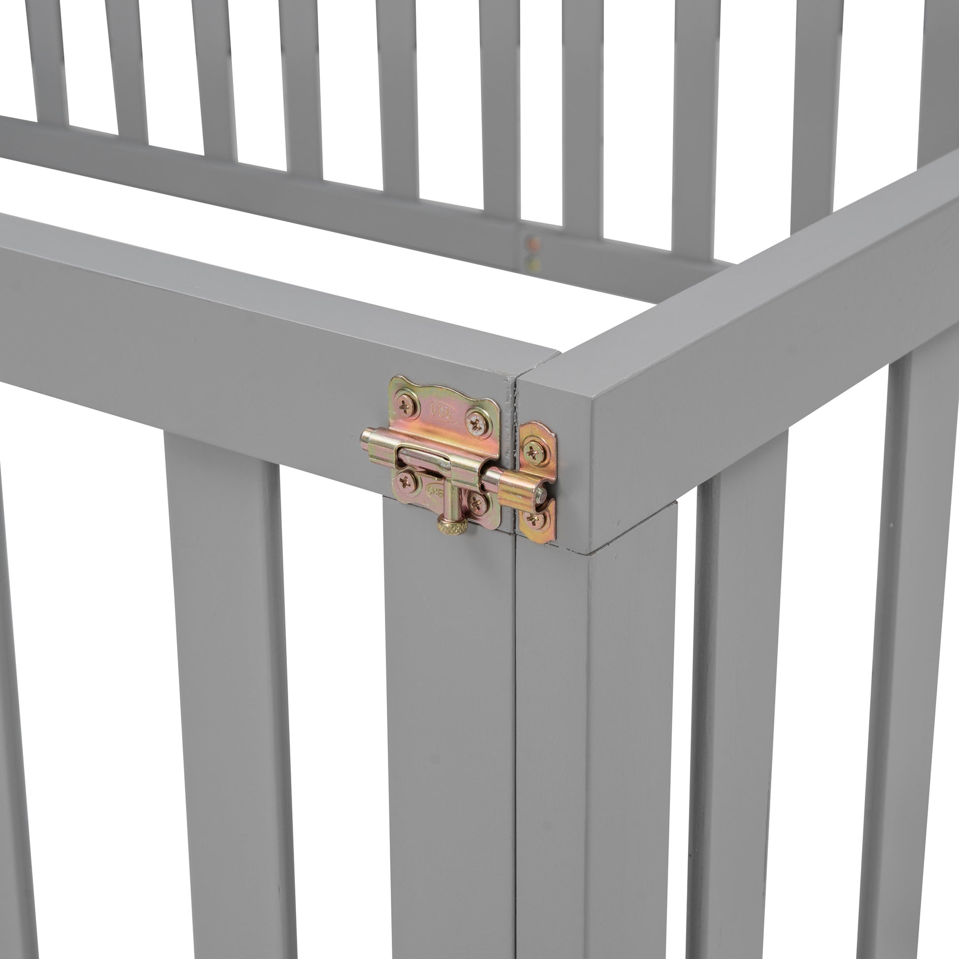 Closeup of a gray wooden baby crib with a silver metal latch