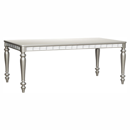 Silver dining table with ornate mirrored trim and turned legs for a glamorous dining room