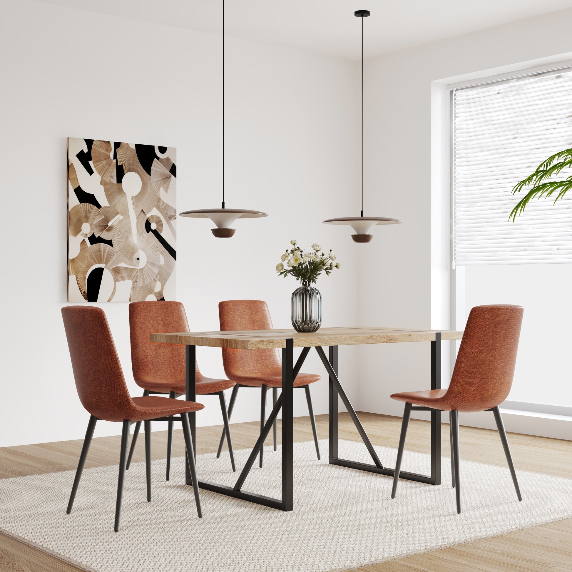 Four rustcolored upholstered dining chairs with black metal legs surround a rustic wood dining table