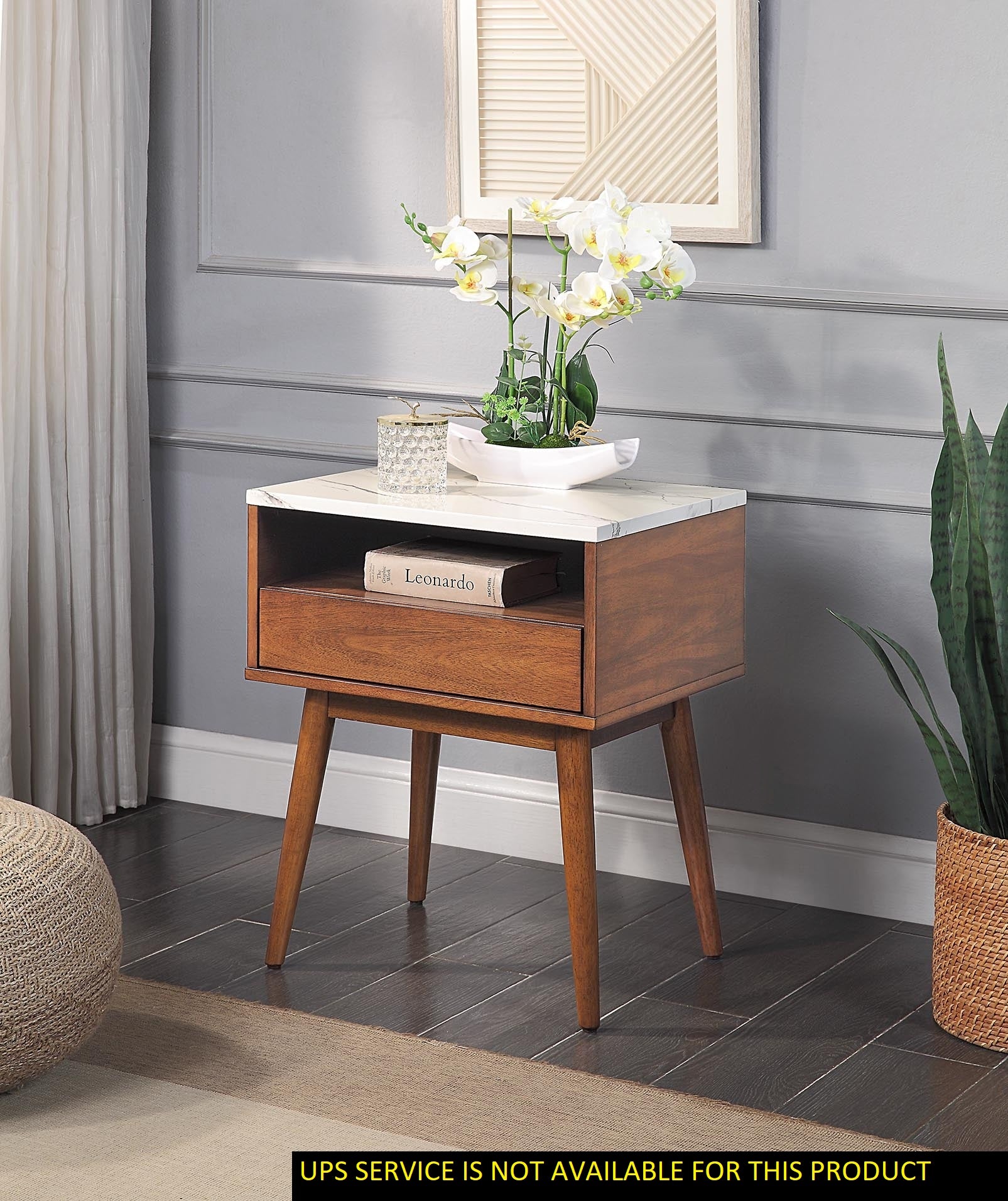 Midcentury modern walnut nightstand with white marble top drawer and orchid decor