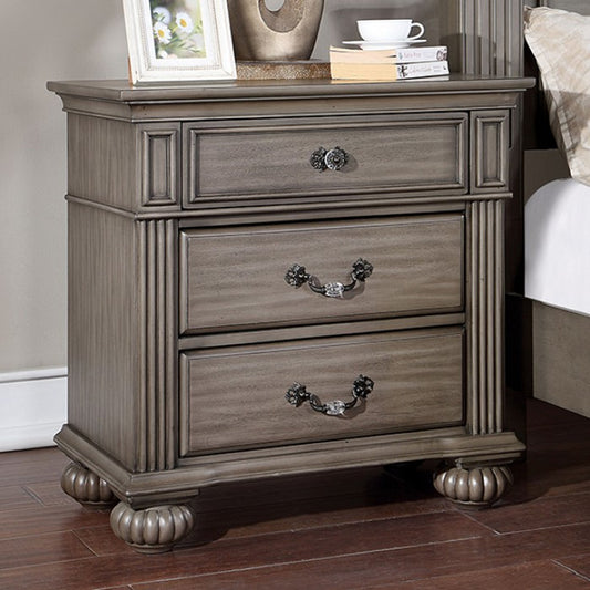 Antique gray wood nightstand with ornate handles and three drawers for bedroom storage