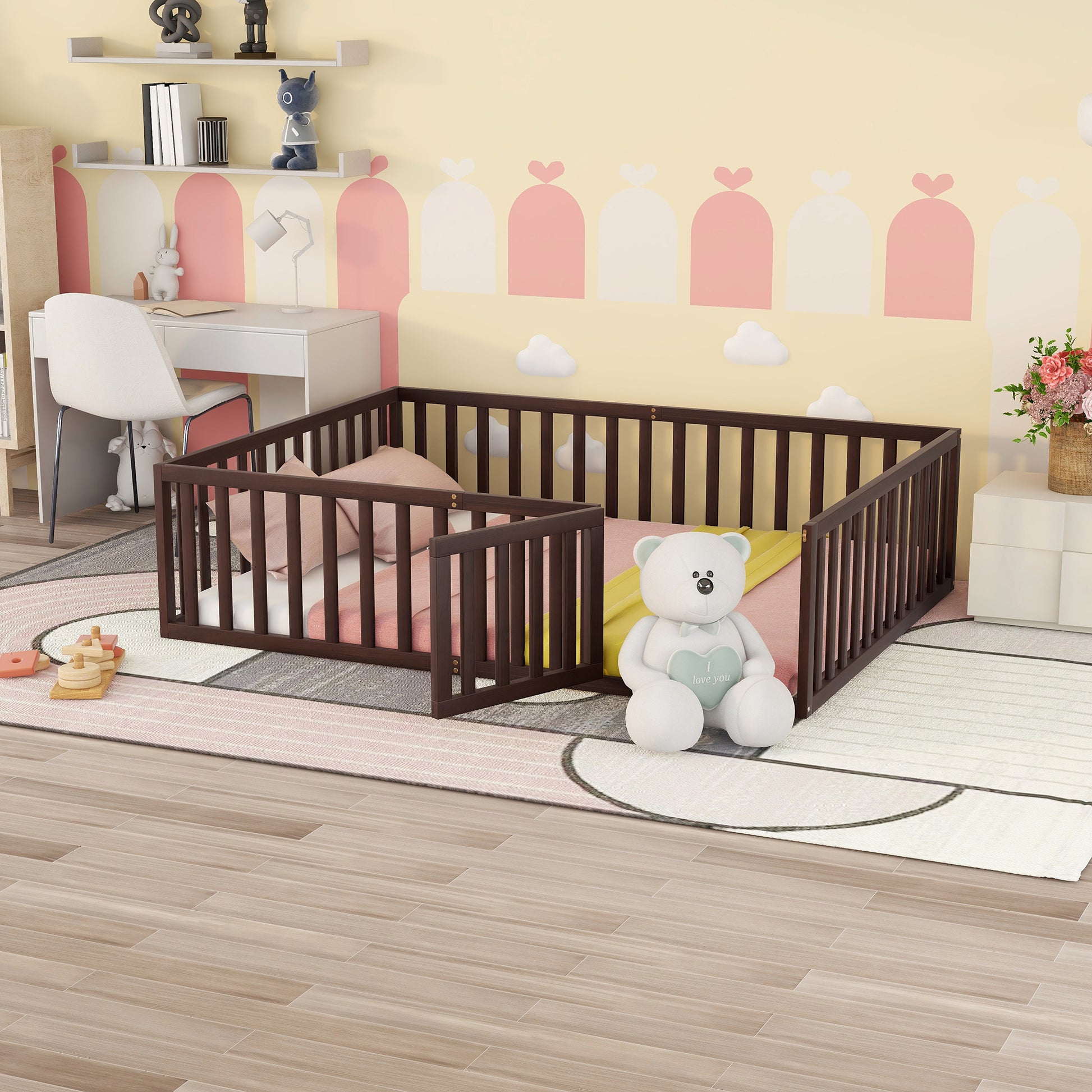 Dark brown wooden toddler bed frame with mattress and pillows