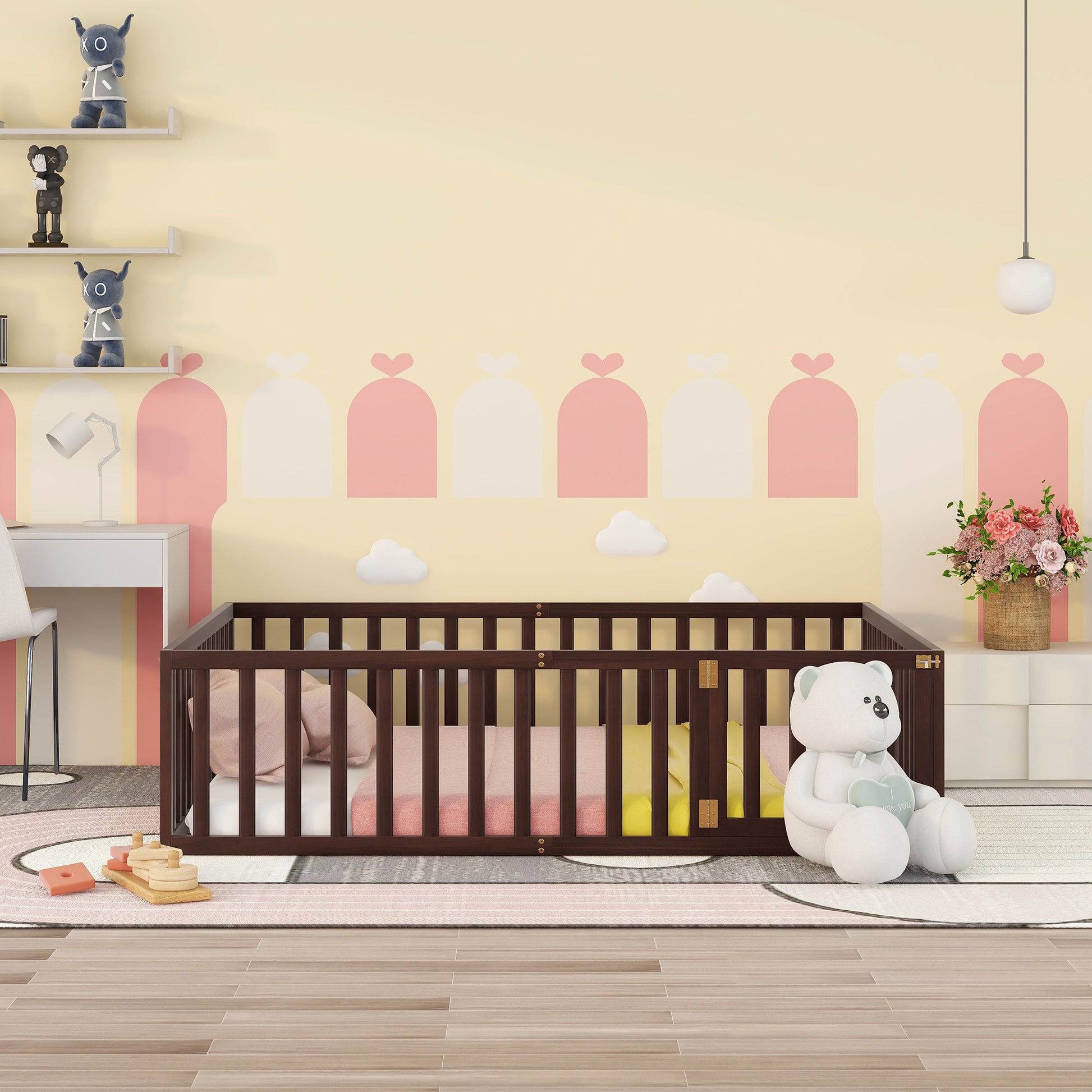 Dark wood baby crib with pink and yellow bedding