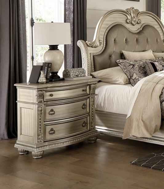 Ornate carved silver nightstand with marble top two drawers and decorative hardware