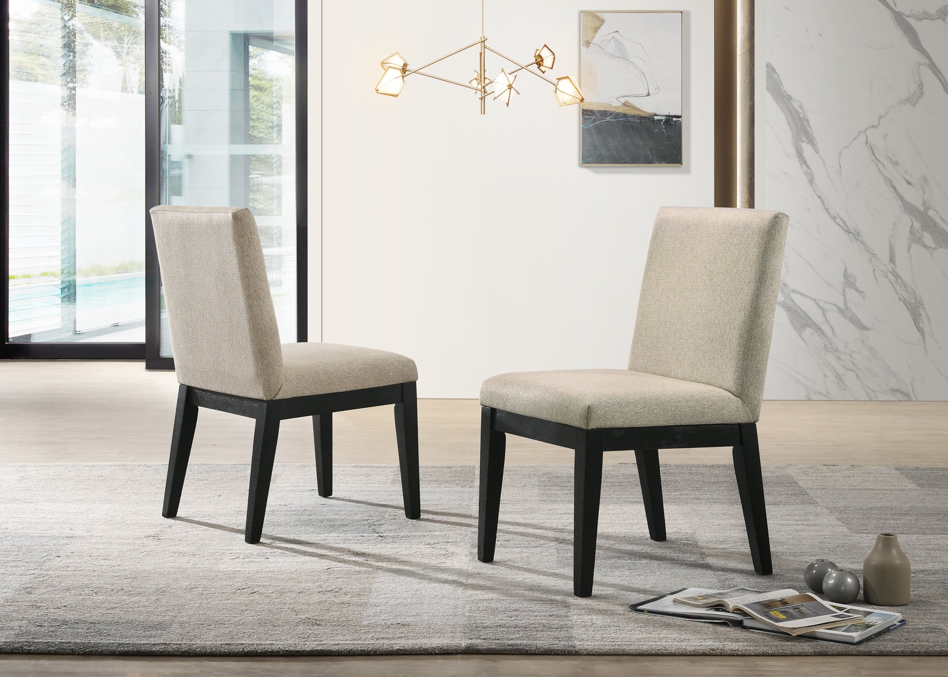 Two upholstered dining chairs with dark wood legs