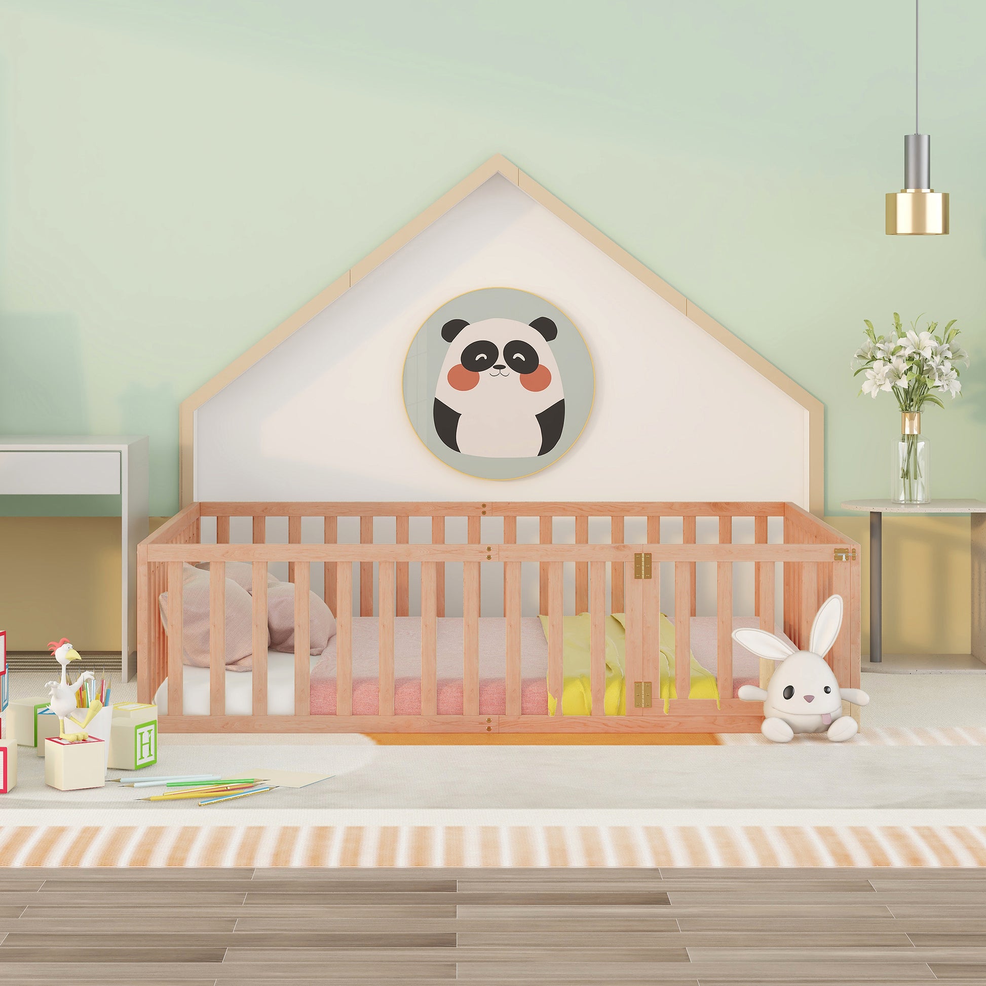 Wooden toddler bed with pink bedding and a yellow blanket