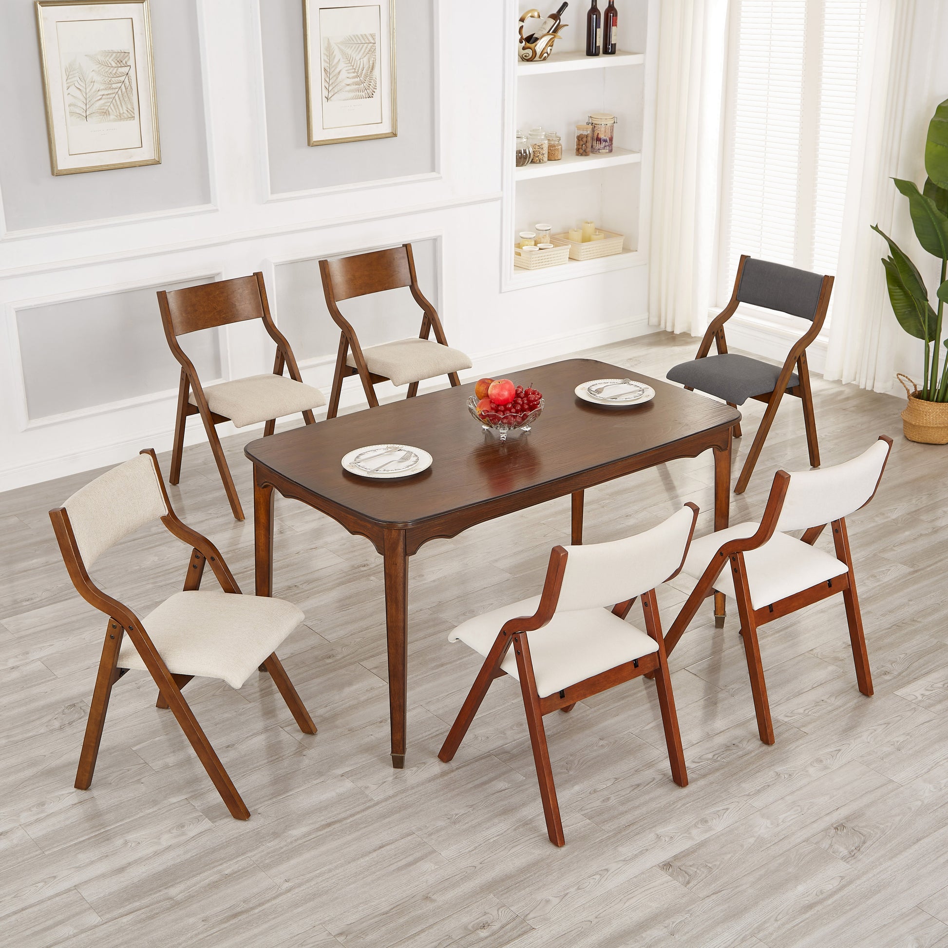 Wood dining chairs with beige fabric seats and matching dining table