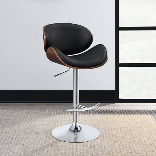 Black leather bar stool with curved wood accents and chrome base