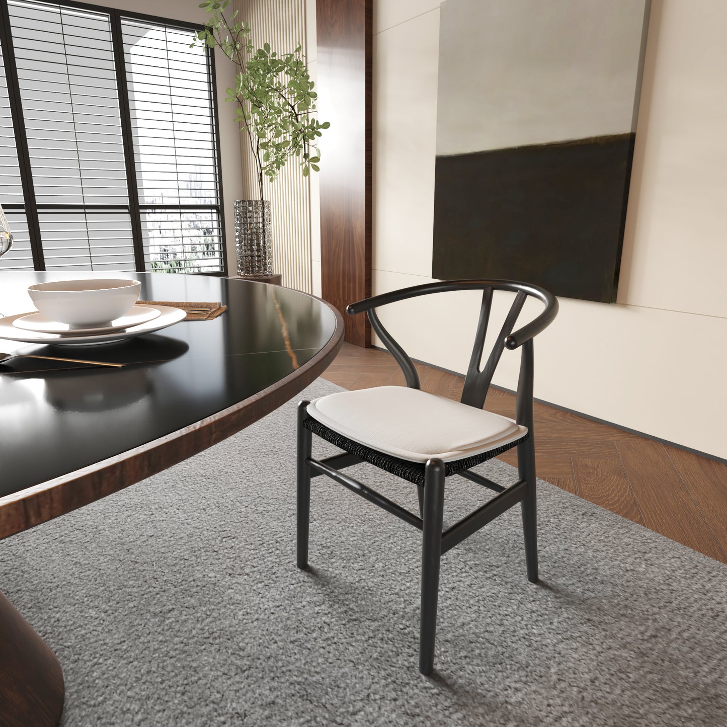 Black wishbone chair with white cushion