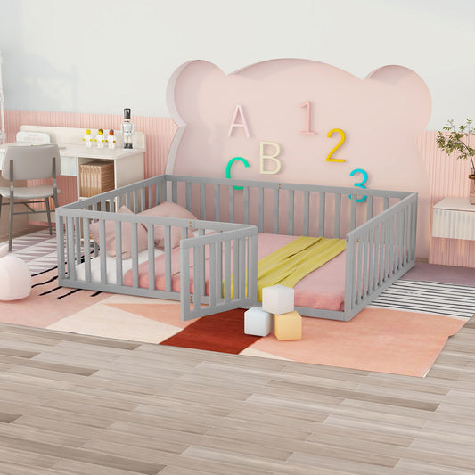 Gray wooden toddler bed with pink bedding and yellow blanket