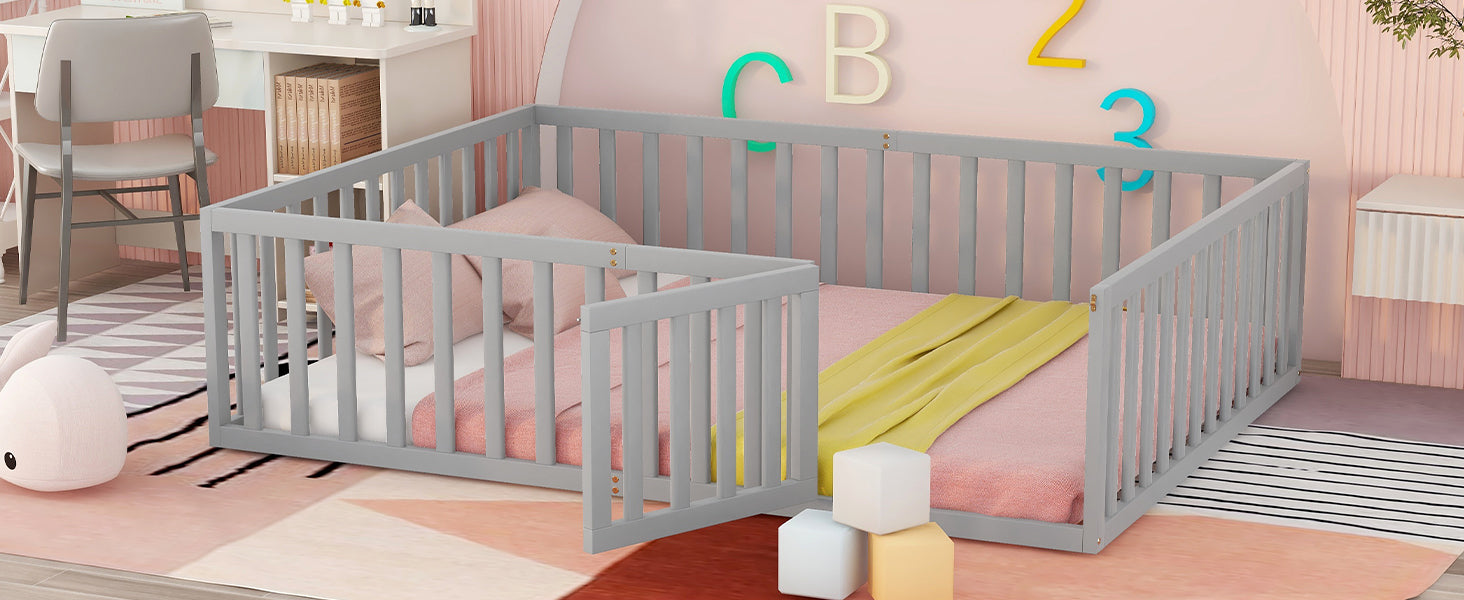 Gray toddler bed with safety rails and pink bedding ideal for nursery transition