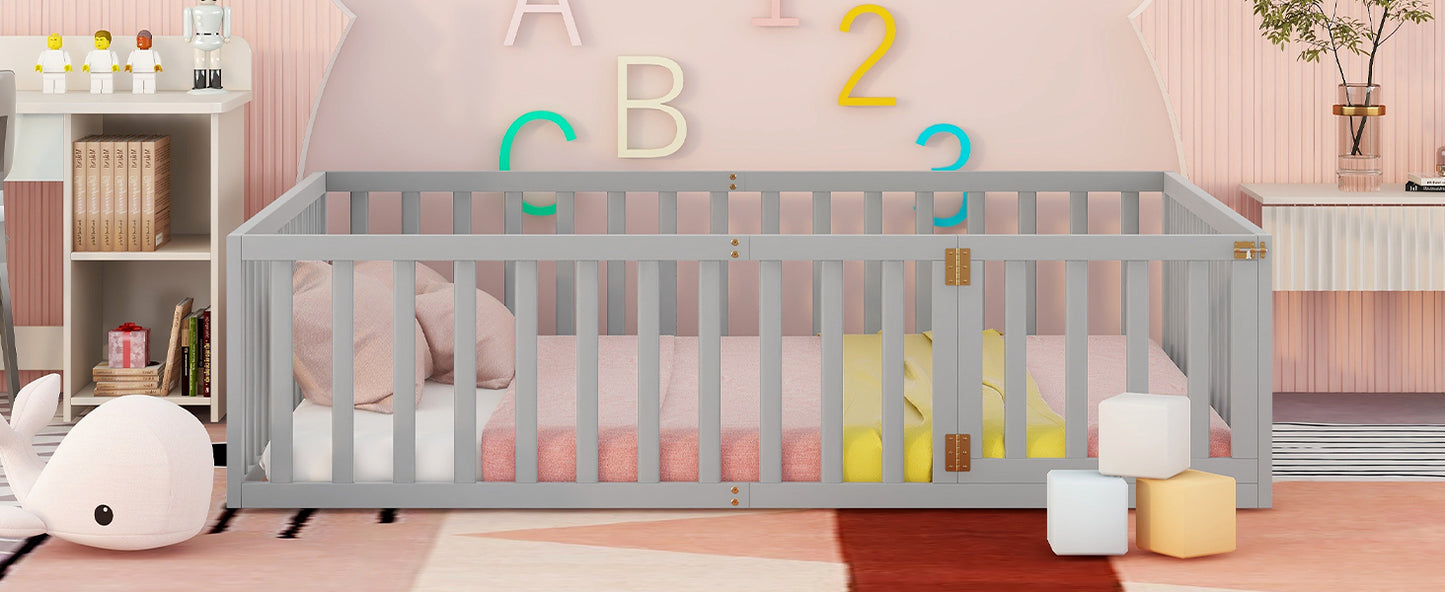 Classic grey wooden baby crib with soft pink bedding and toys