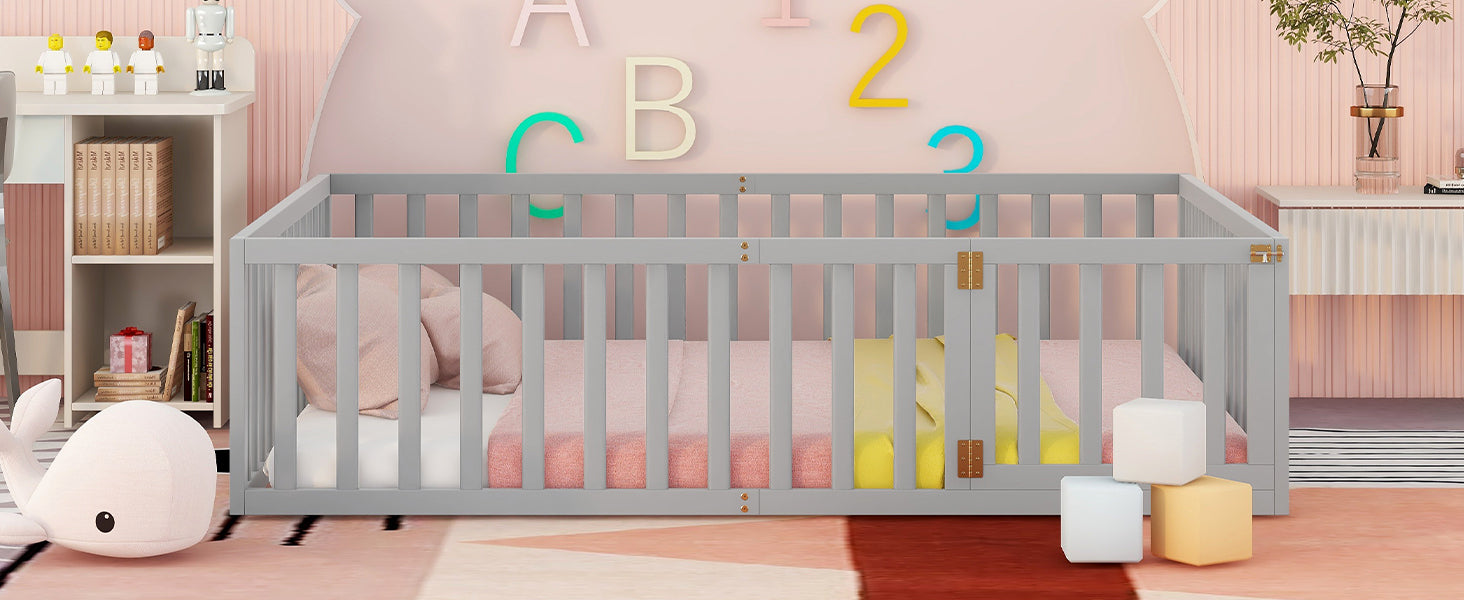 Classic grey wooden baby crib with soft pink bedding and toys