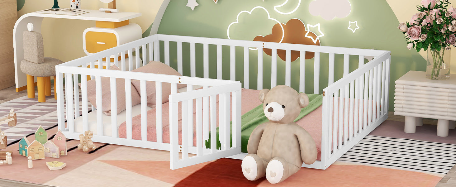 White wooden convertible crib with pink bedding and a teddy bear
