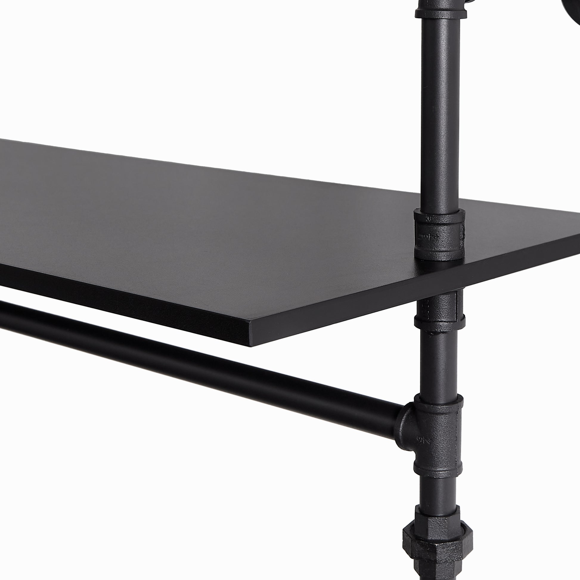 Close up of black metal pipe shelf support