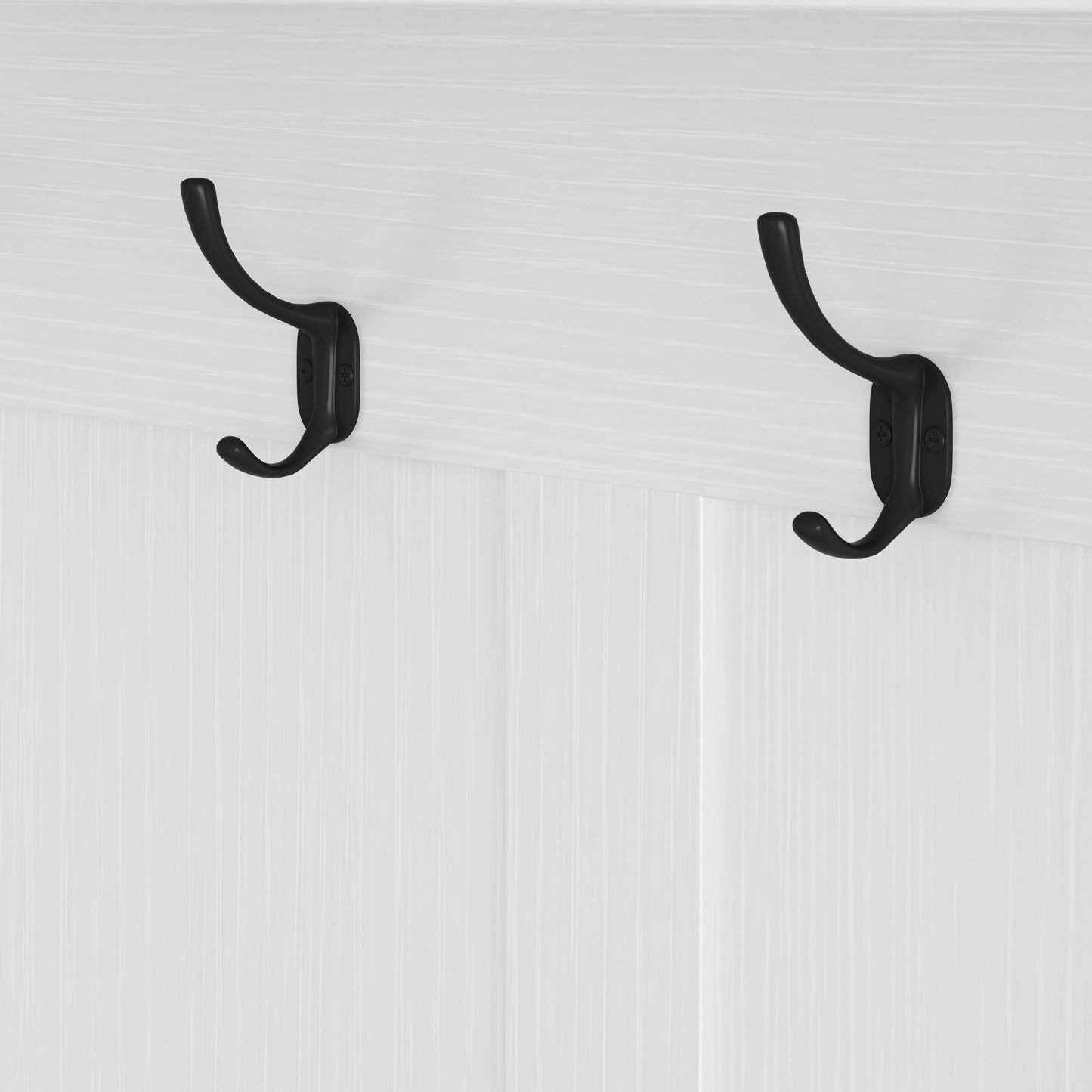 Classic black metal double coat hooks on a white beadboard background