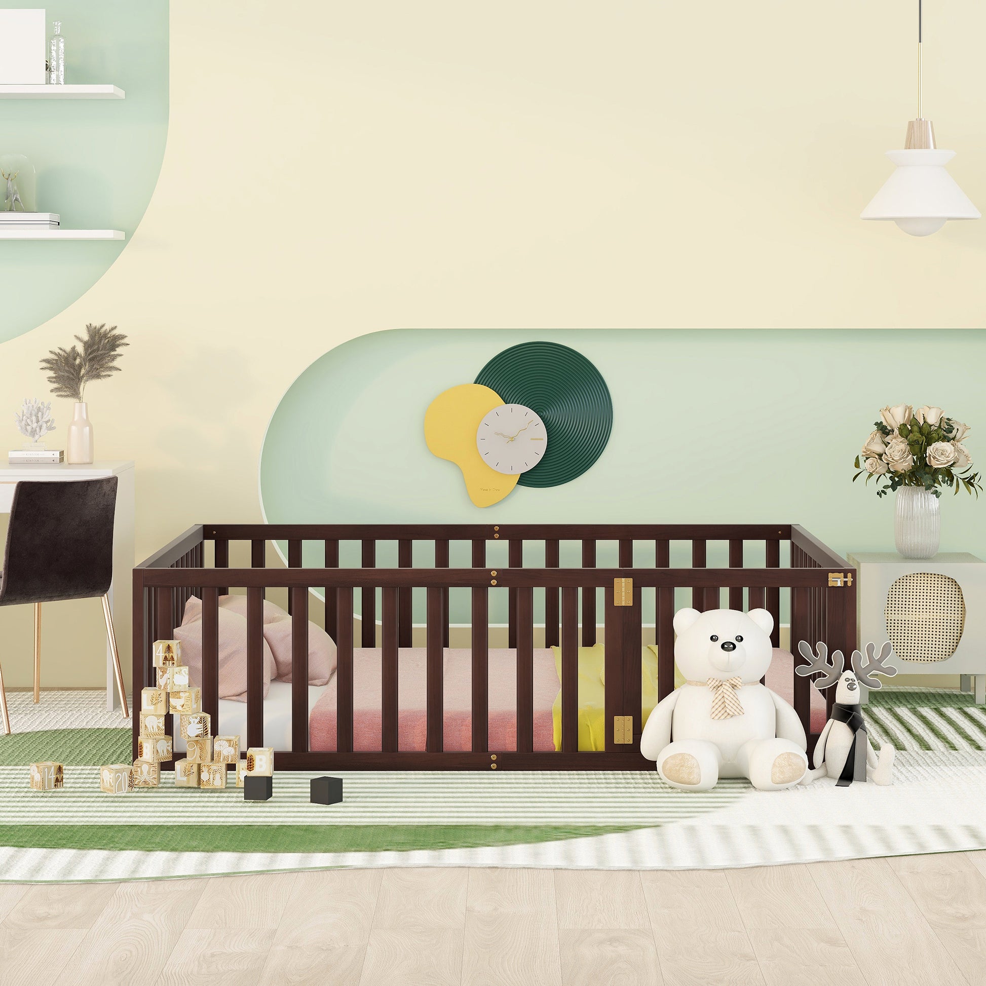 Dark wood convertible crib with mattress and pillows