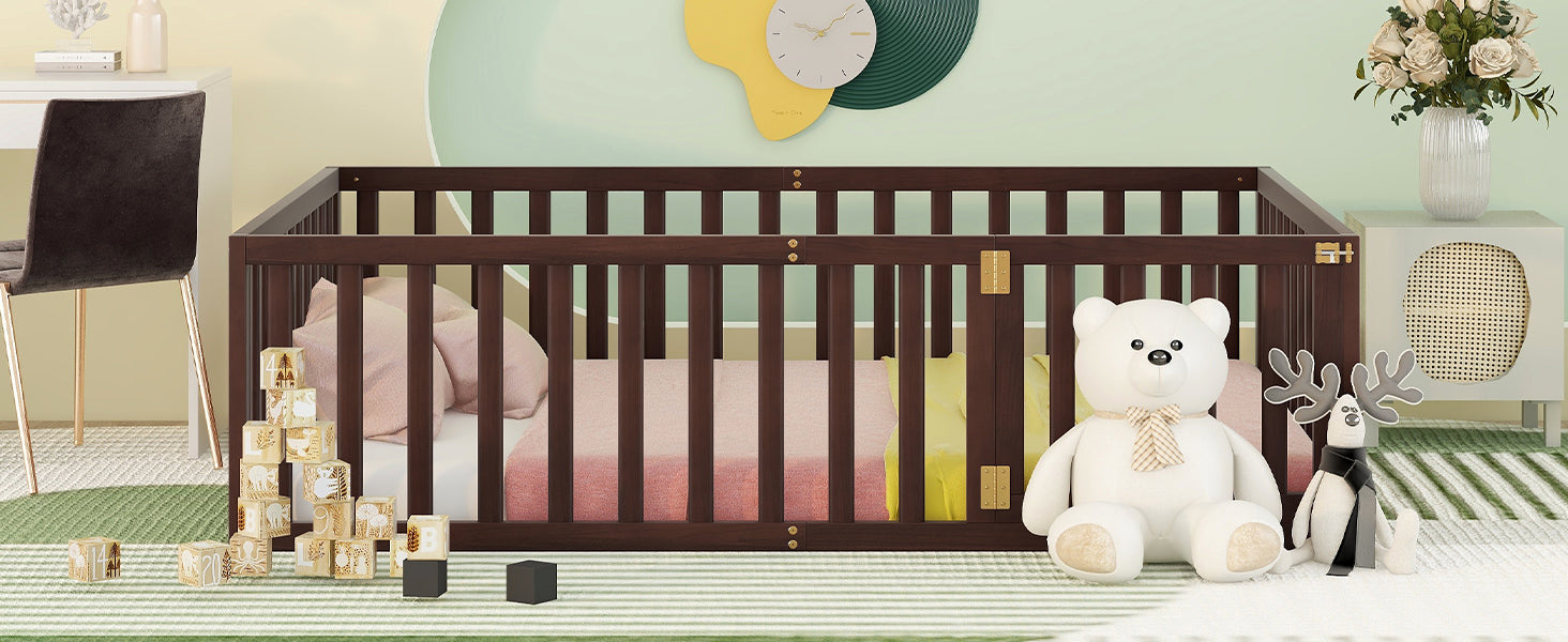 Dark wood convertible crib with pink bedding and plush toys
