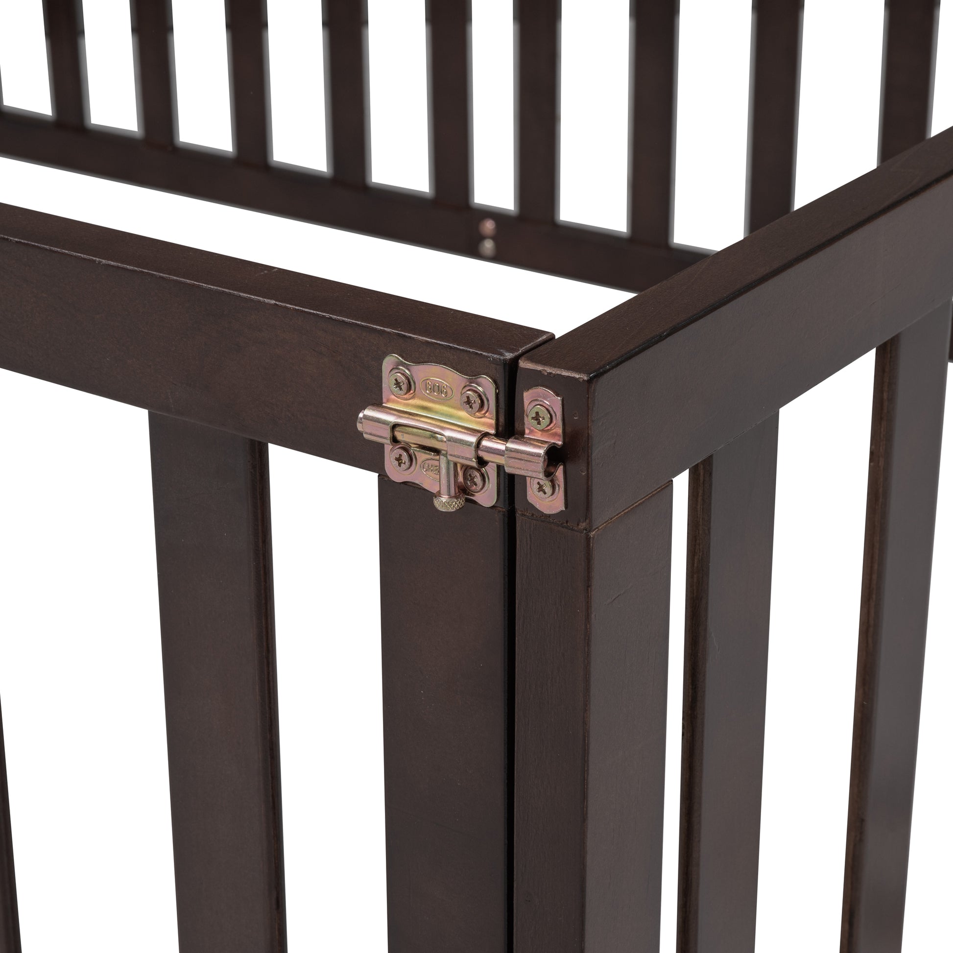 Dark brown wooden crib frame detail with metal latch