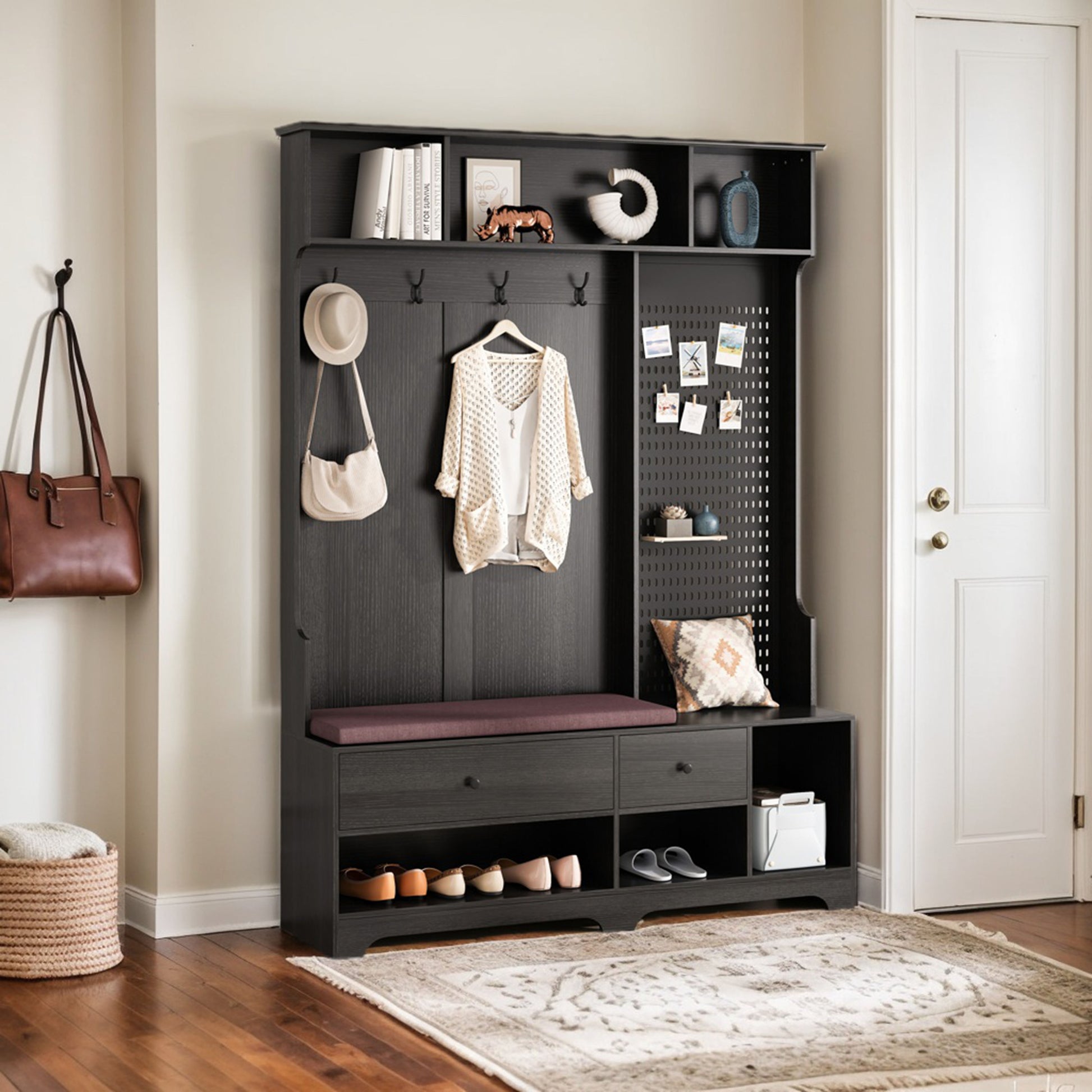Black entryway hall tree with bench and shoe storage