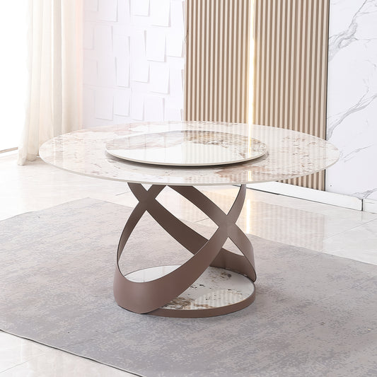 Round marble dining table with a modern sculptural base and lazy susan