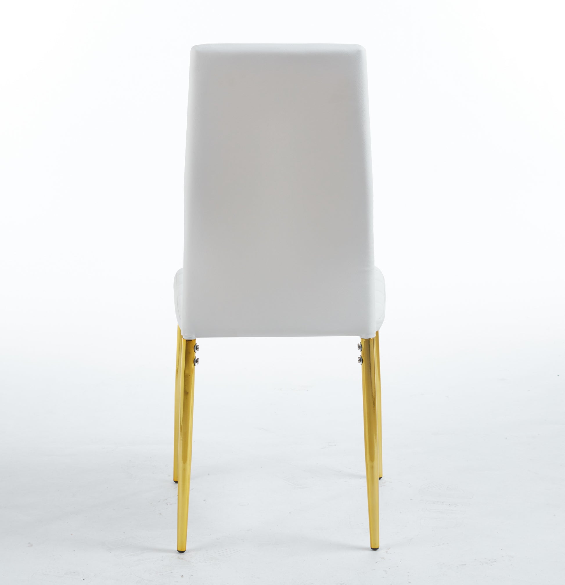 White upholstered accent chair with shiny gold tapered legs