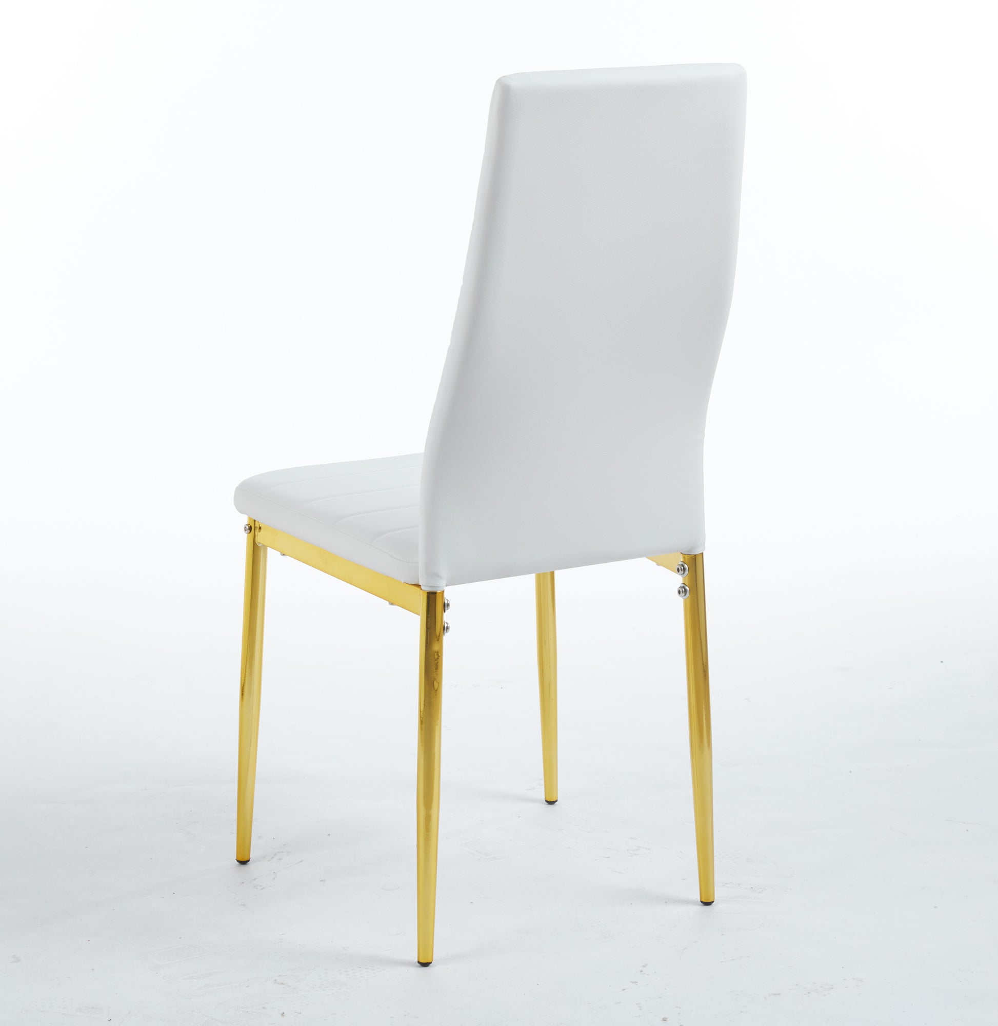 White faux leather dining chair with gold metal legs