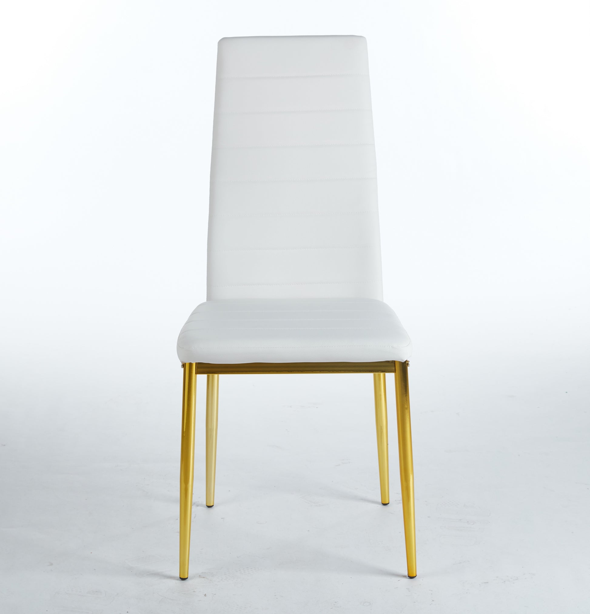 White faux leather dining chair with quilted back and gold metal legs