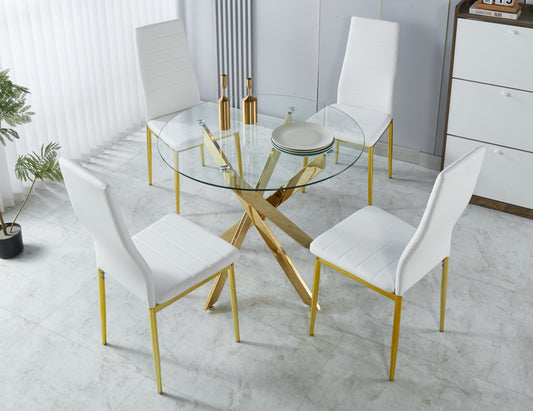 Modern glass dining table with gold base and four white chairs