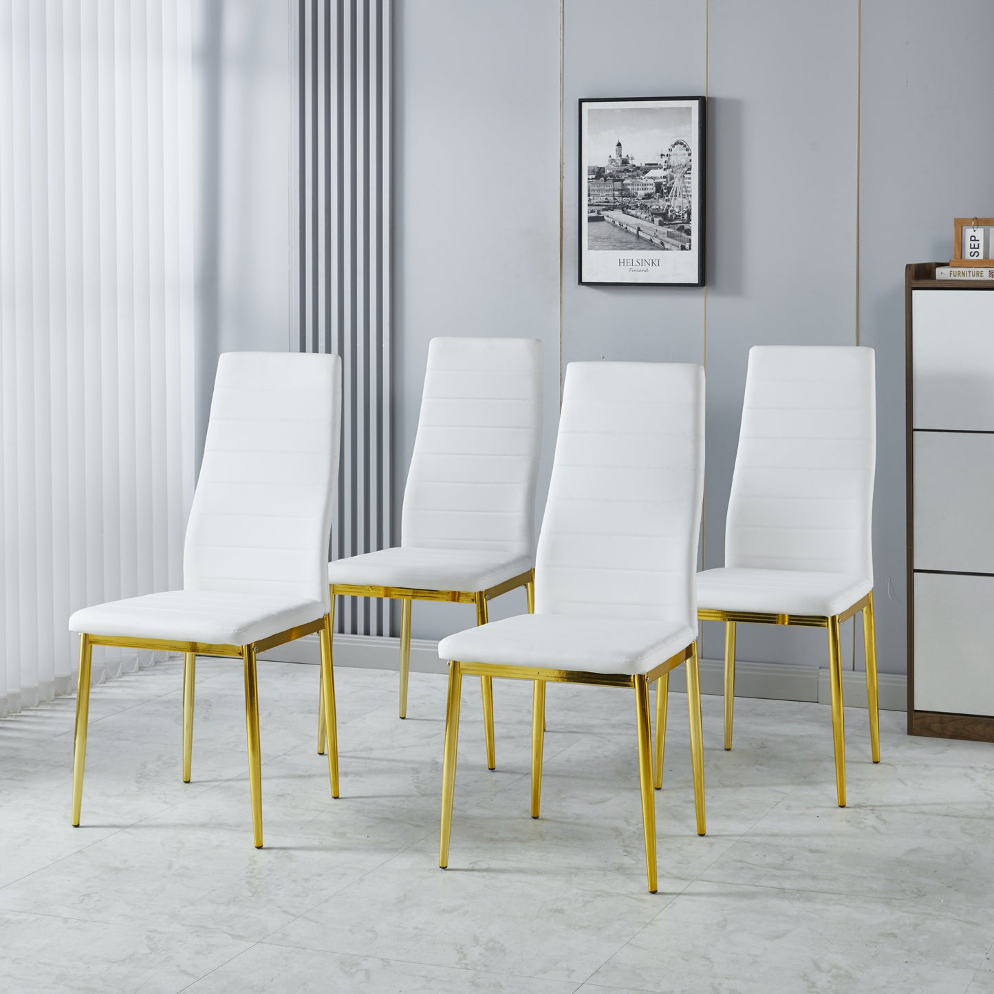 Set of four white faux leather dining chairs with gold metal legs
