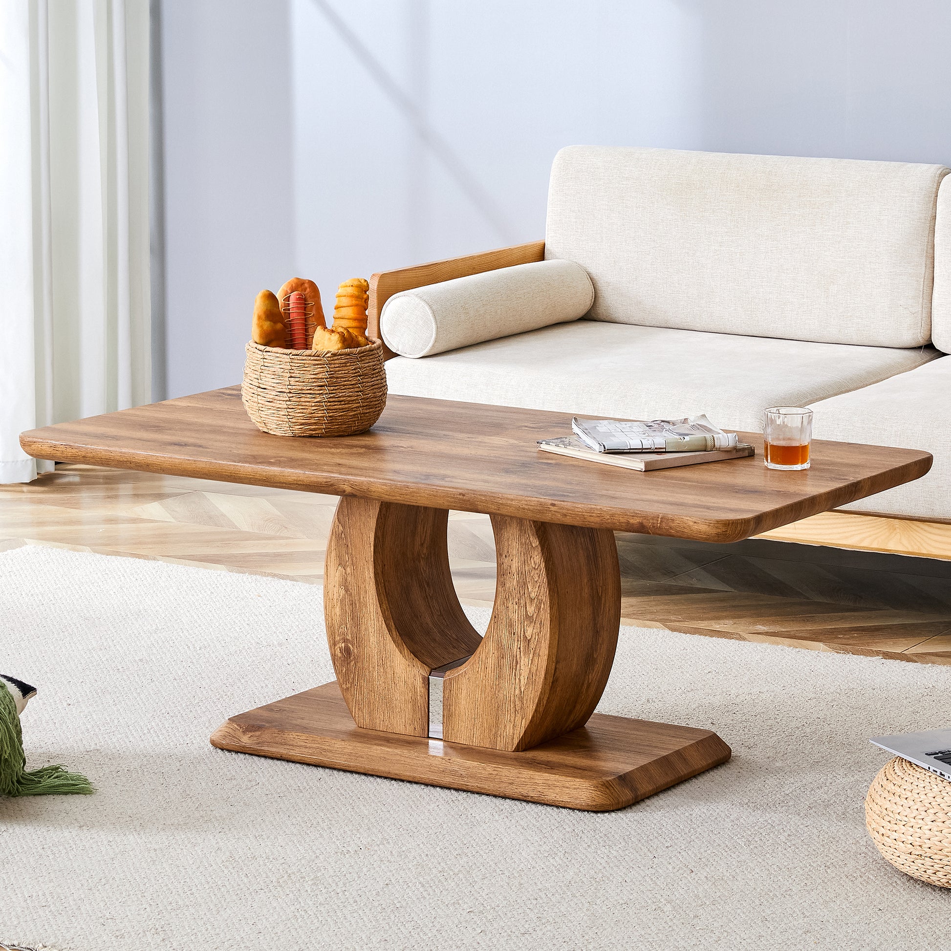 Rectangular wooden coffee table with a curved pedestal base