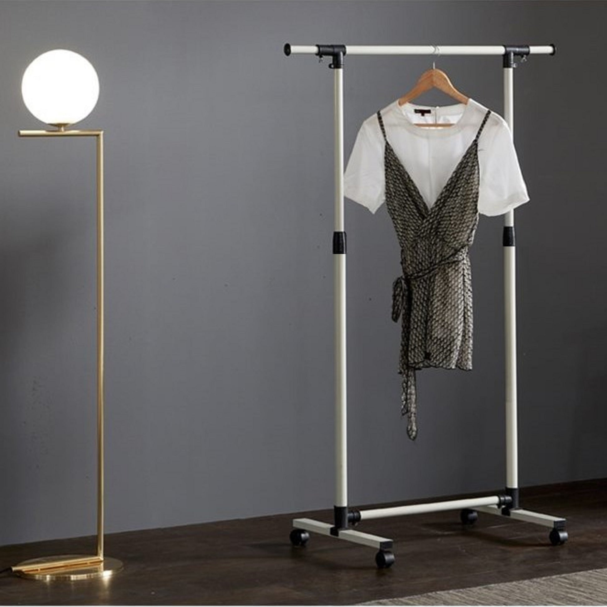 Modern brass floor lamp with white globe shade